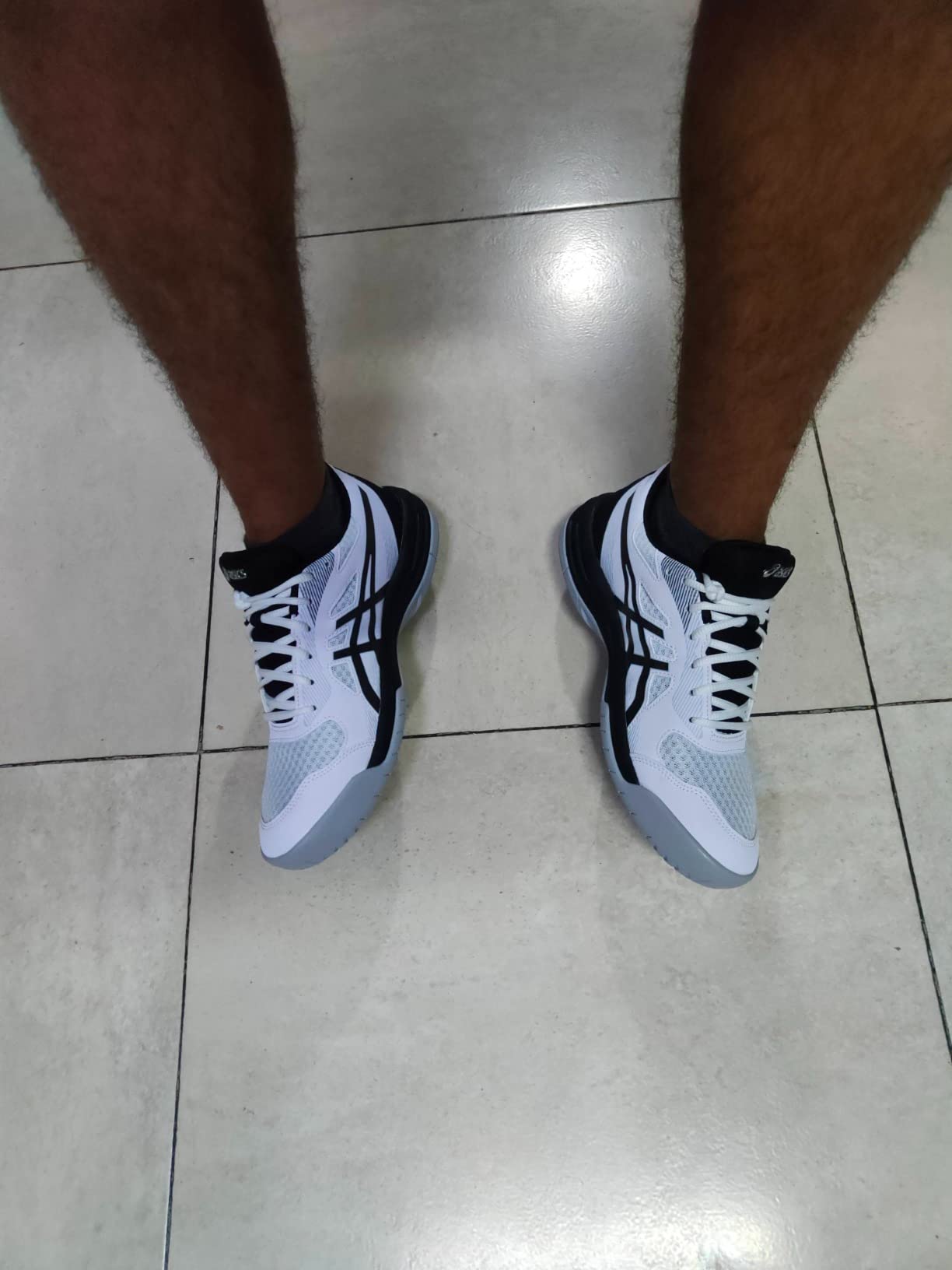 ASICS Upcourt 5 heel and ankle view showing collar support structure and heel counter construction