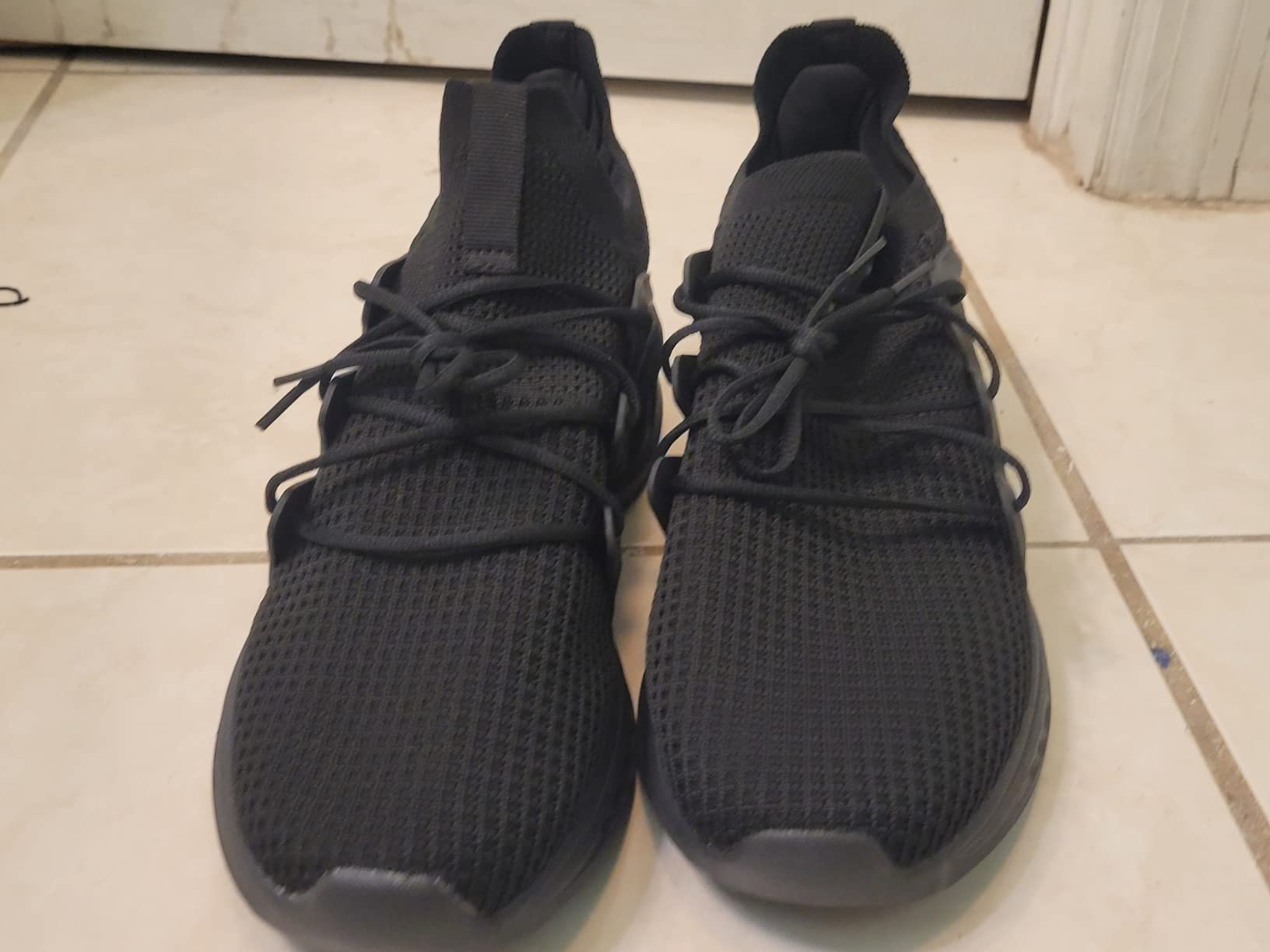 Bottom sole view showing EVA foam cushioning technology and non-slip rubber tread pattern design with minimal wear after testing