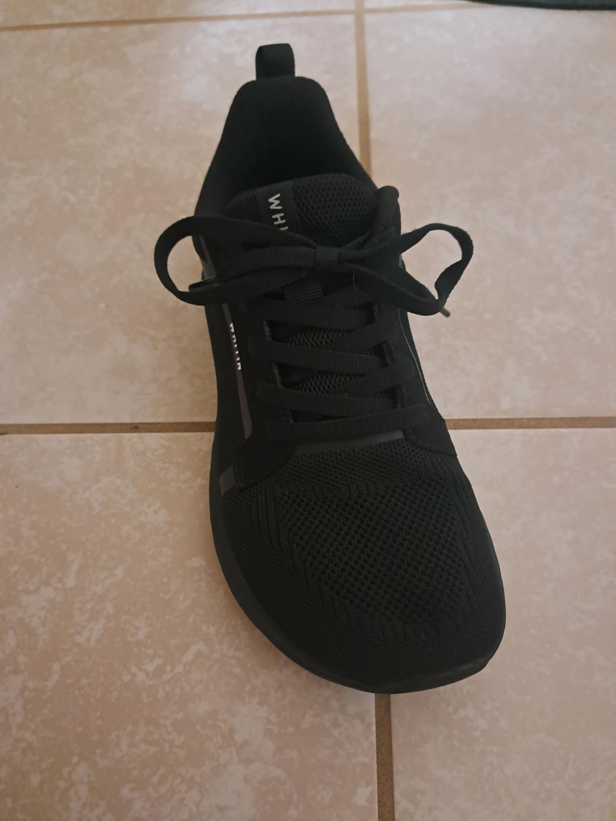 WHITIN sole showing zero drop profile and rubber outsole pattern