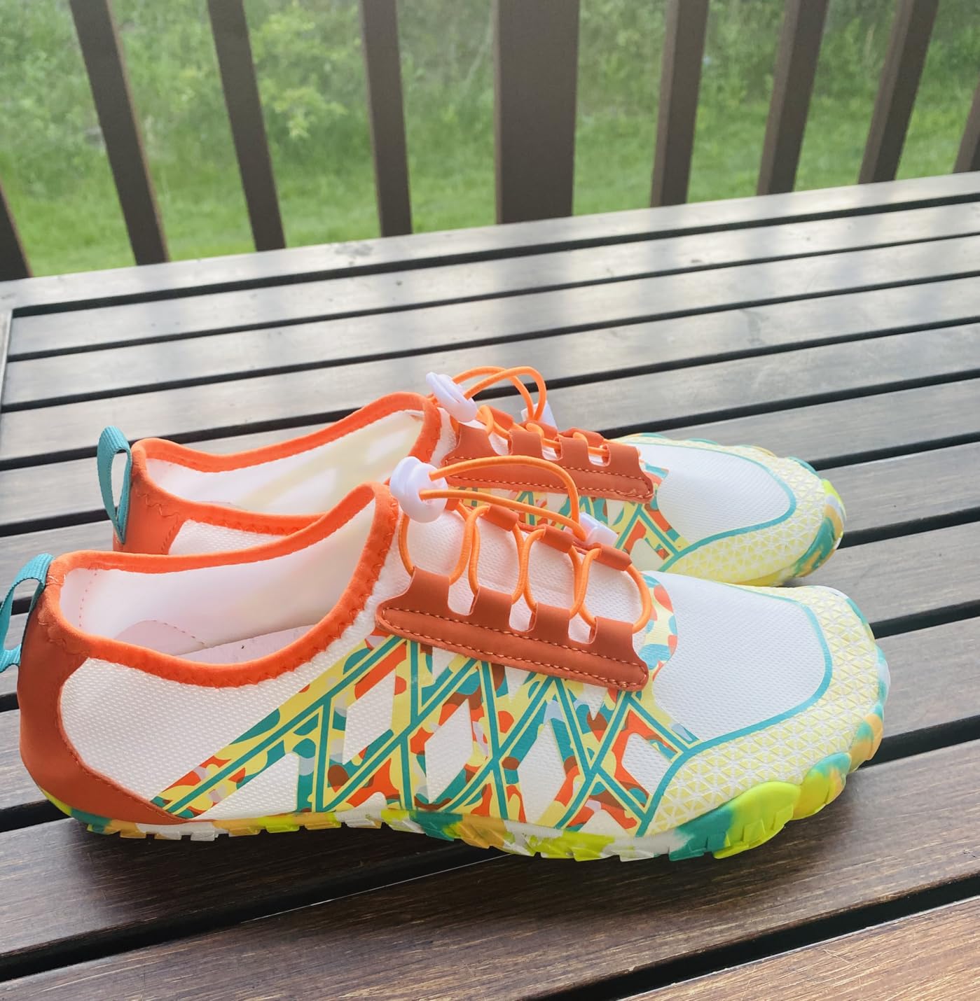 Water shoe sole showing flexible rubber with drainage holes and non-slip tread pattern for wet surfaces