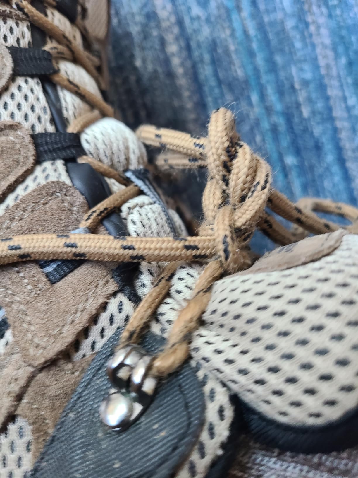 Detailed view of lace fraying from metal eyelets after 6 weeks of testing