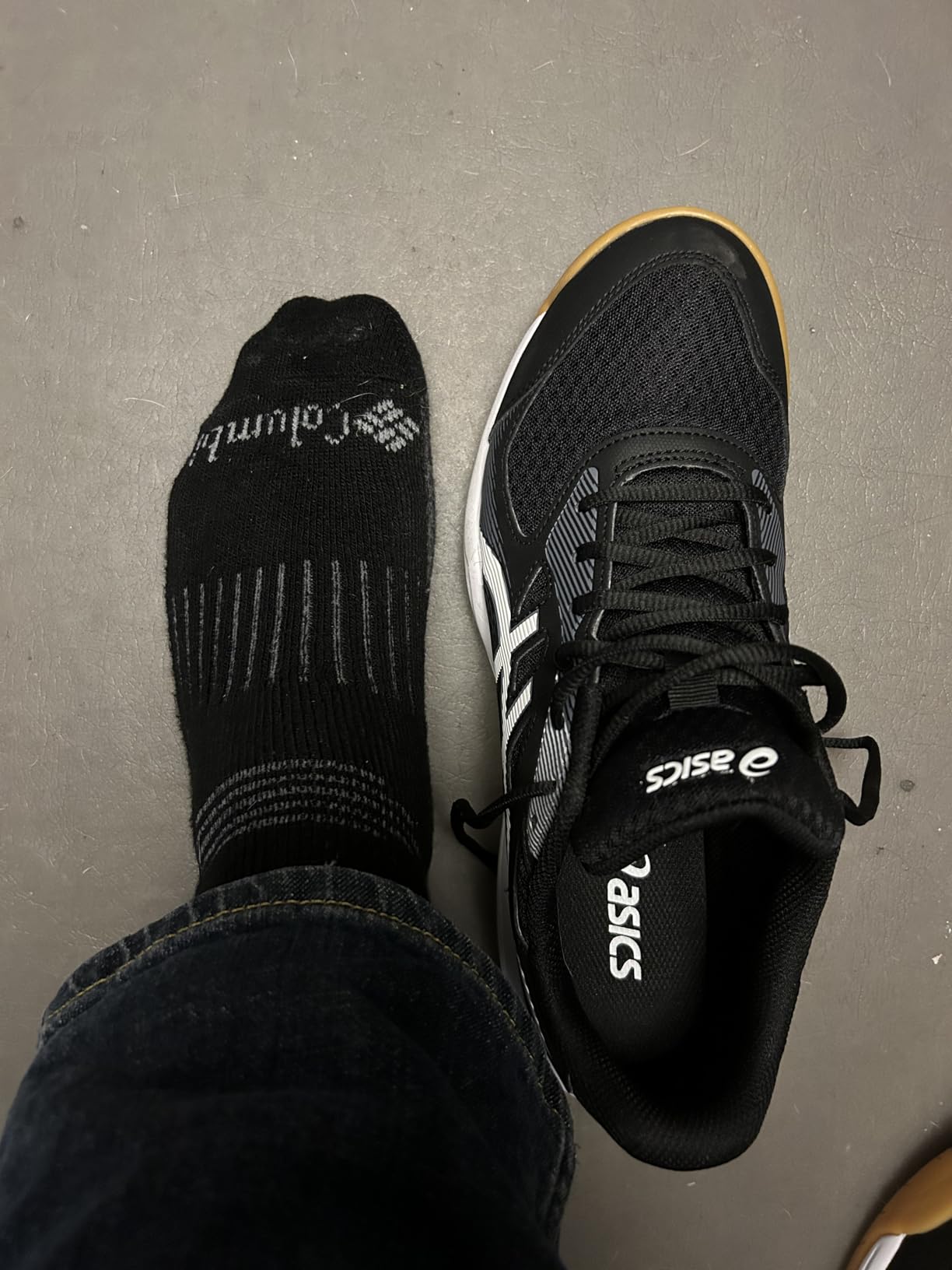 ASICS Upcourt 5 on foot showing narrow fit profile and toe box shape for standard width feet