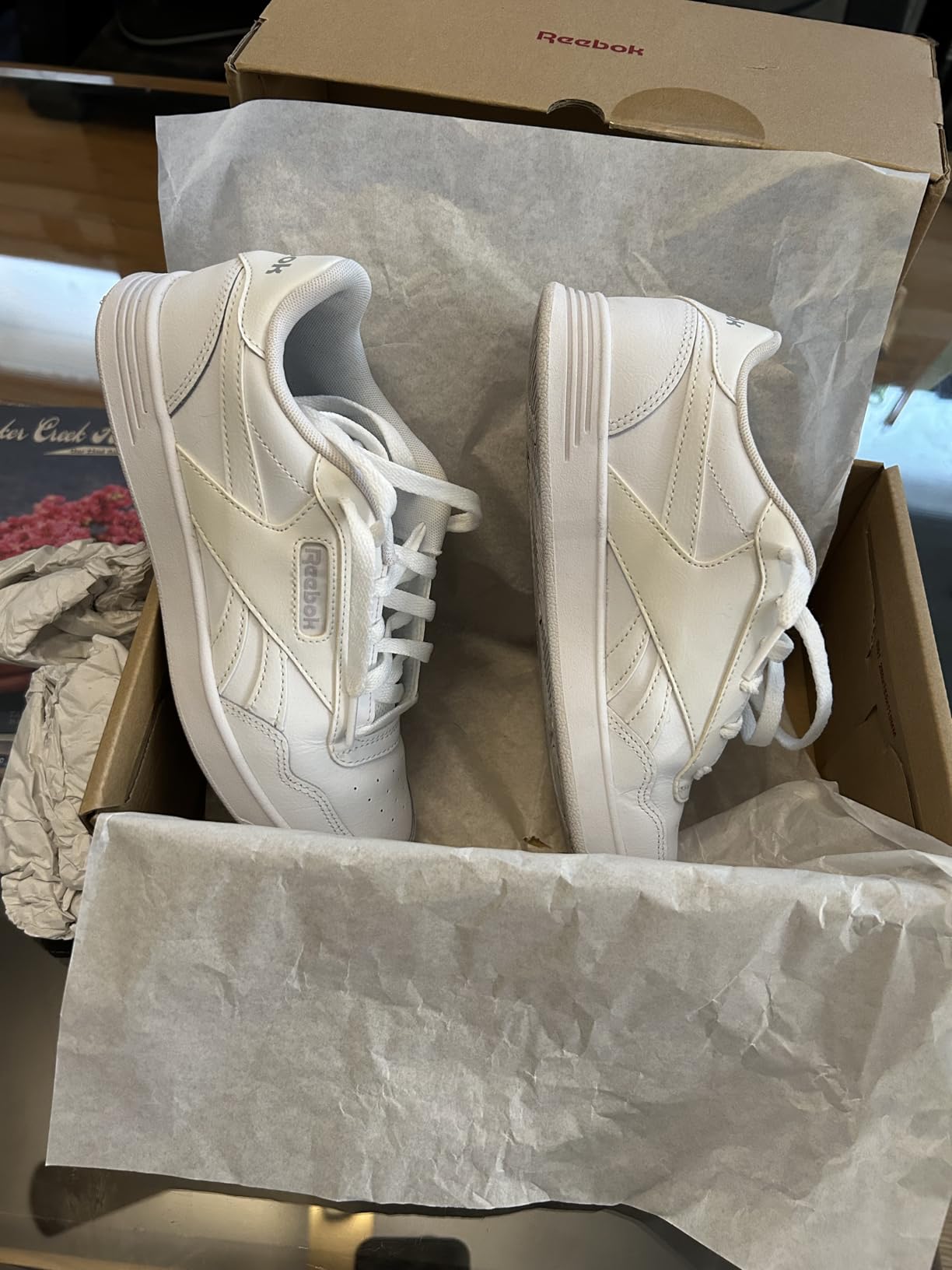 Reebok Court Advance women's white leather sneaker main product view showing clean tennis-inspired design