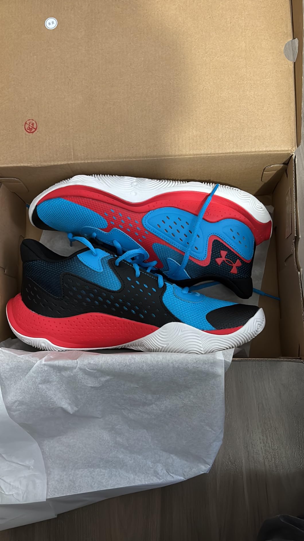 Under Armour Jet 23 on outdoor concrete basketball court showing rubber outsole performance on hard surfaces