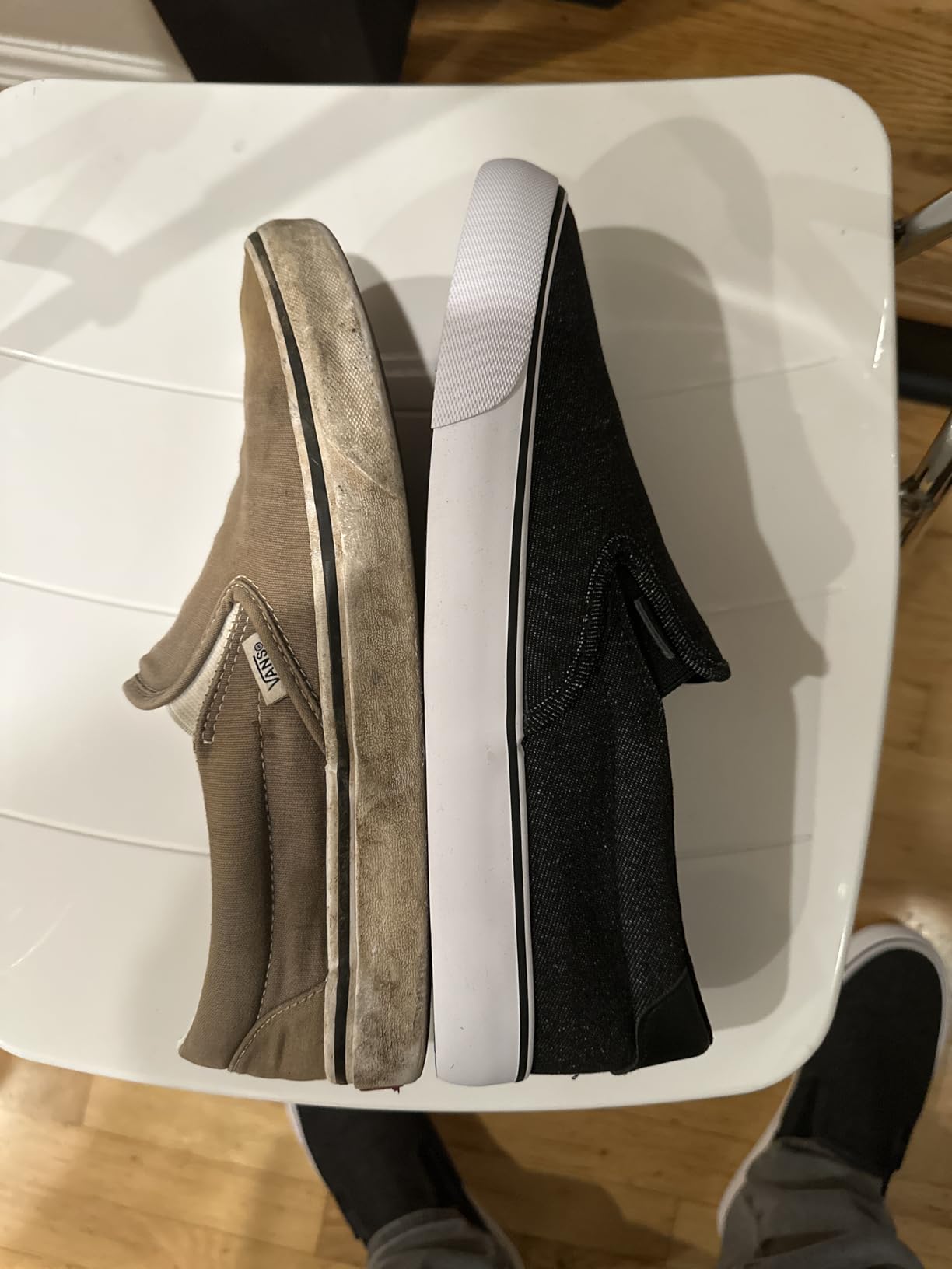 Lugz Clipper placed next to Vans slip-on showing side-by-side size and profile comparison