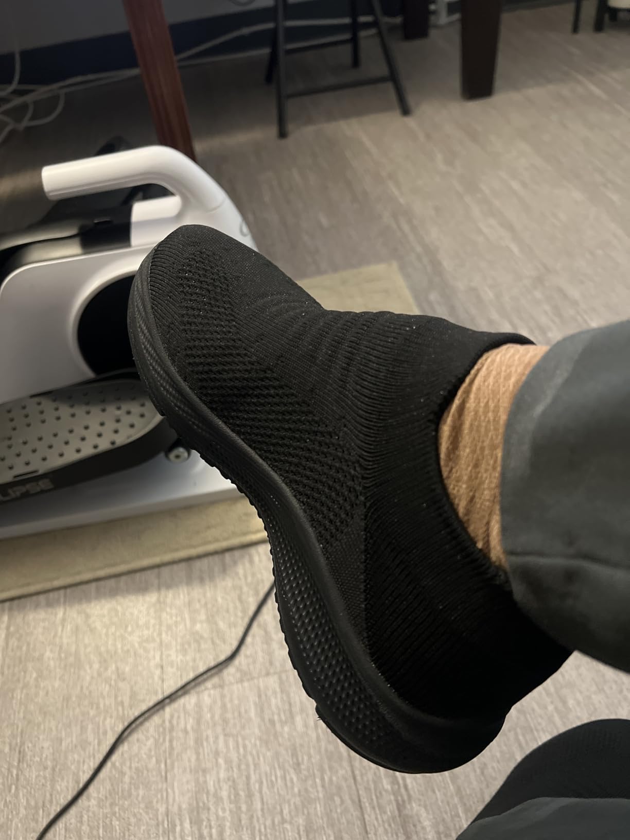 Close-up of SHULOOK walking shoes showing breathable mesh upper construction and slip-on elastic cuff design