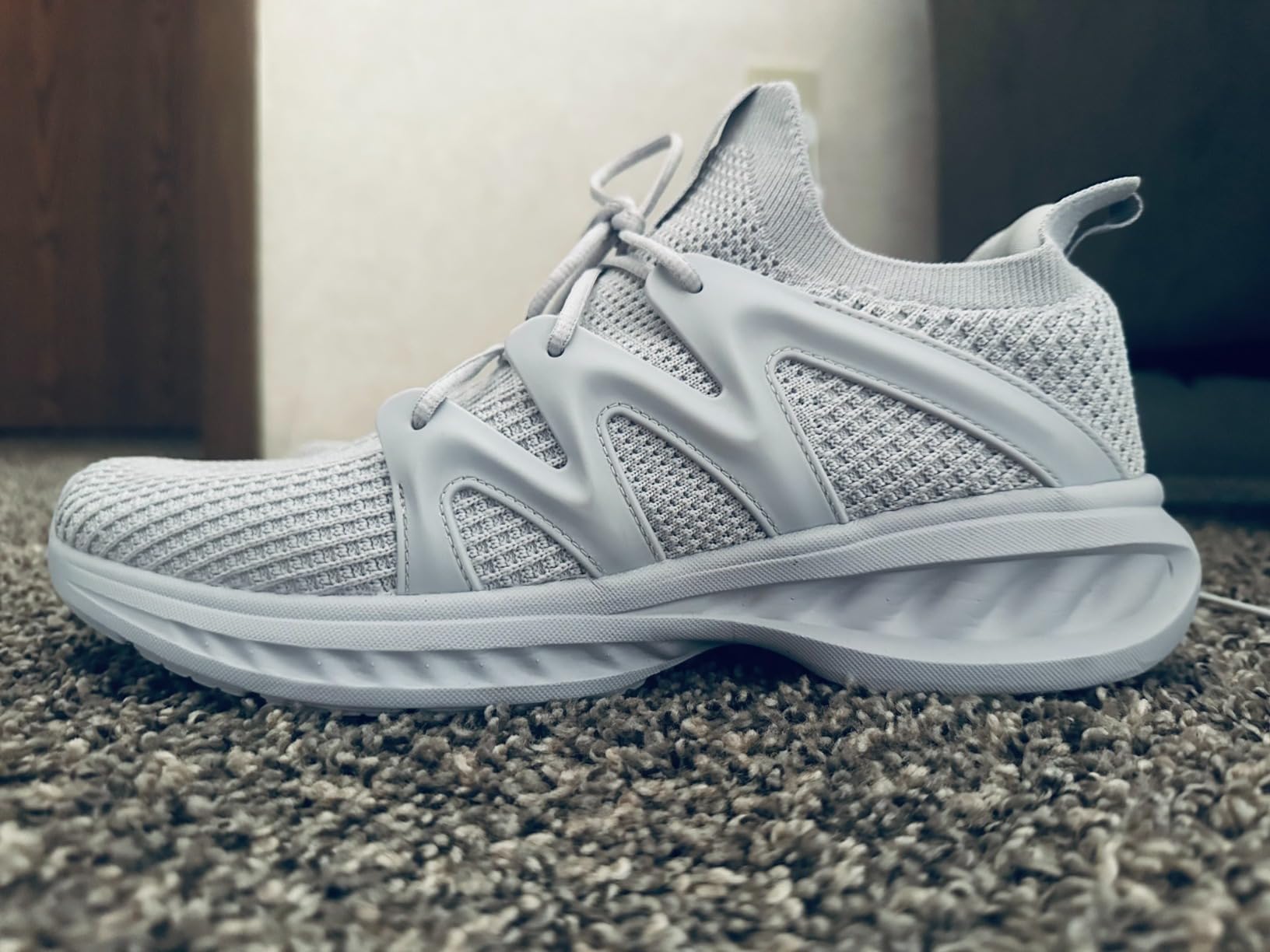 Pujcs Men's Walking Shoes in white colorway showing breathable knit mesh upper and EVA foam sole construction