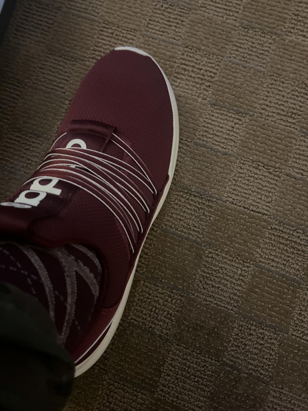 Side profile of Adidas Lite Racer Adapt 7.0 showing Cloudfoam midsole depth and overall silhouette