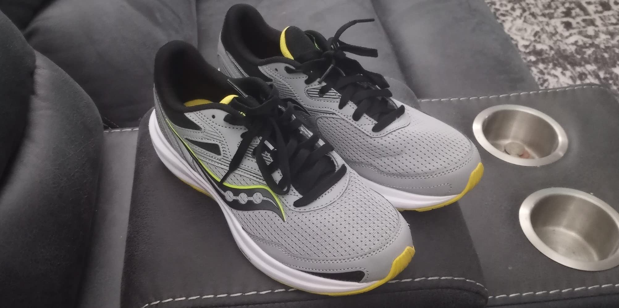 Saucony Cohesion 16 in outdoor running scenario on pavement showing real-world recreational use conditions