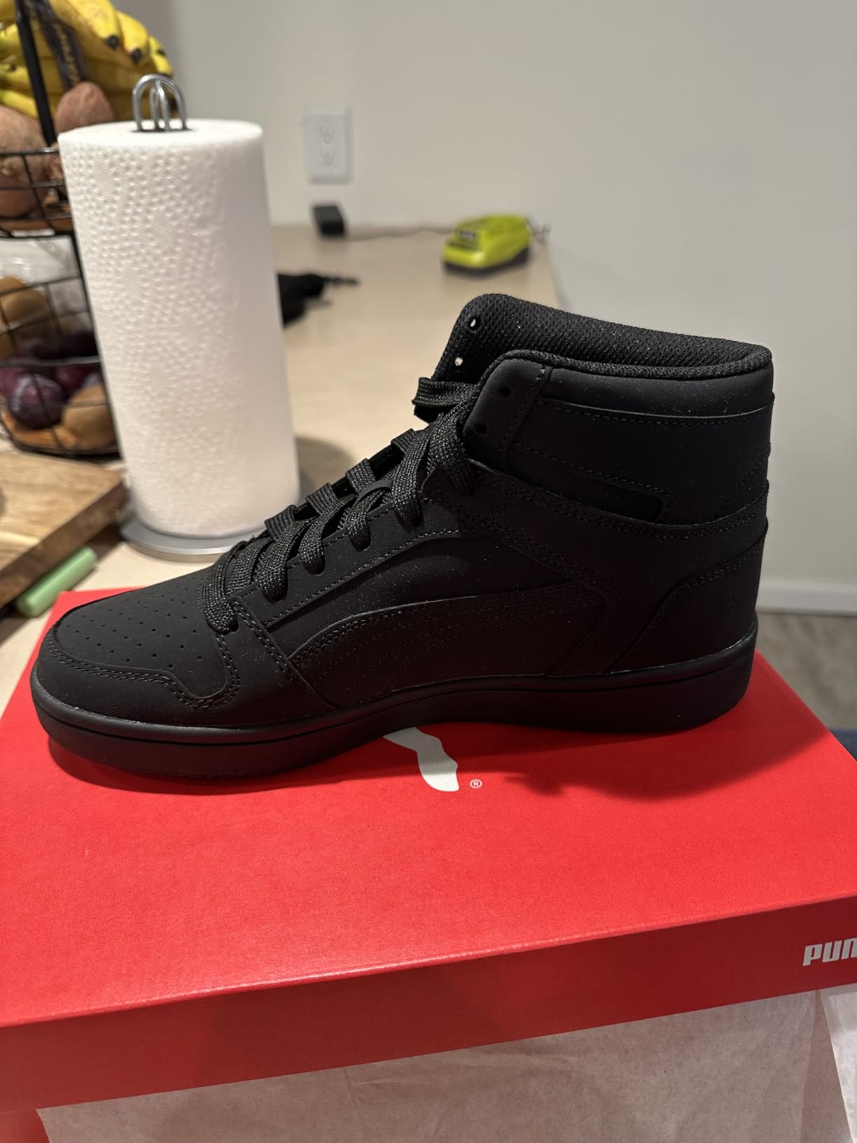 PUMA Rebound Layup padded collar and lacing system detail showing ankle enclosure and mid-top profile