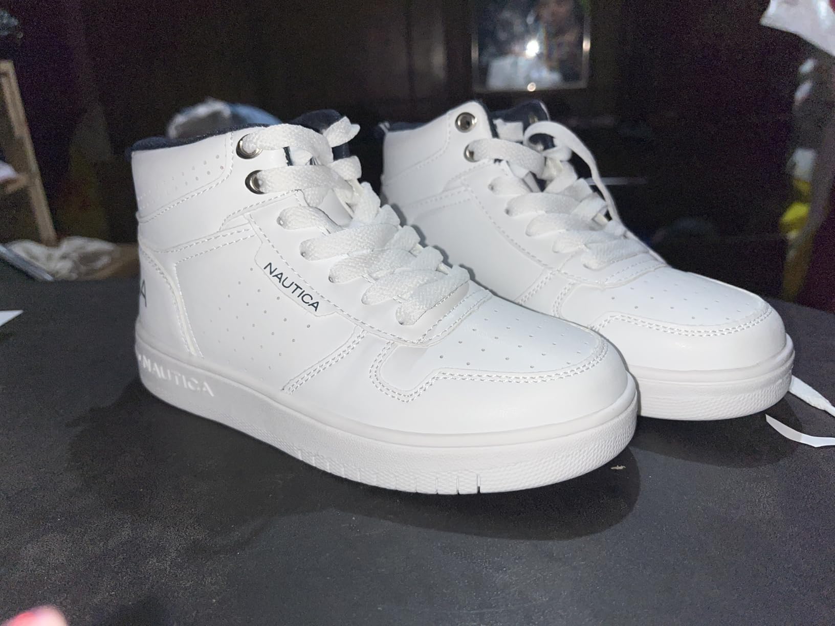 Side profile of Nautica Kids Horizon sneakers showing the boot-like high-top silhouette and lacing system