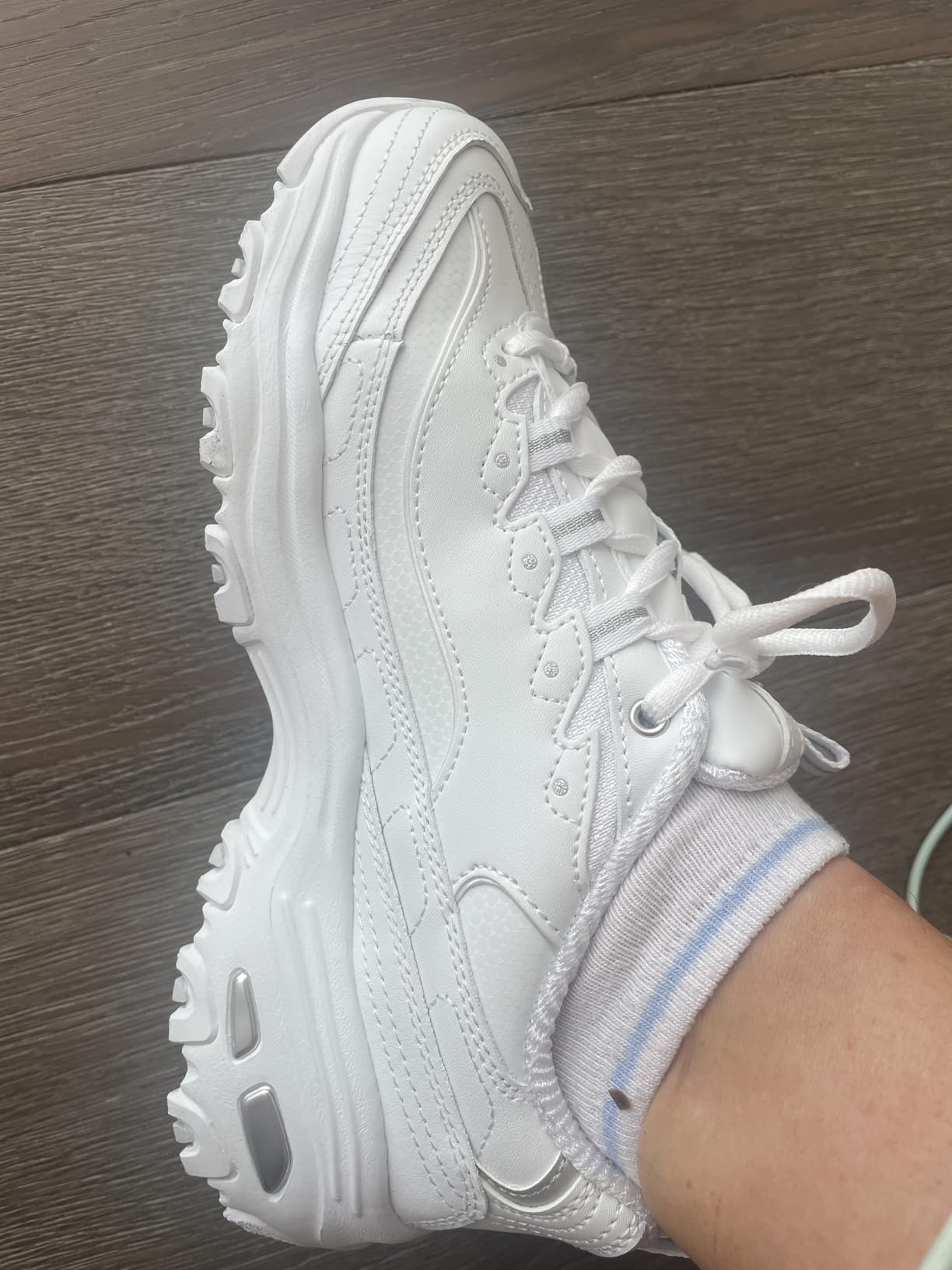Skechers D'Lites product shot highlighting memory foam cushioning features