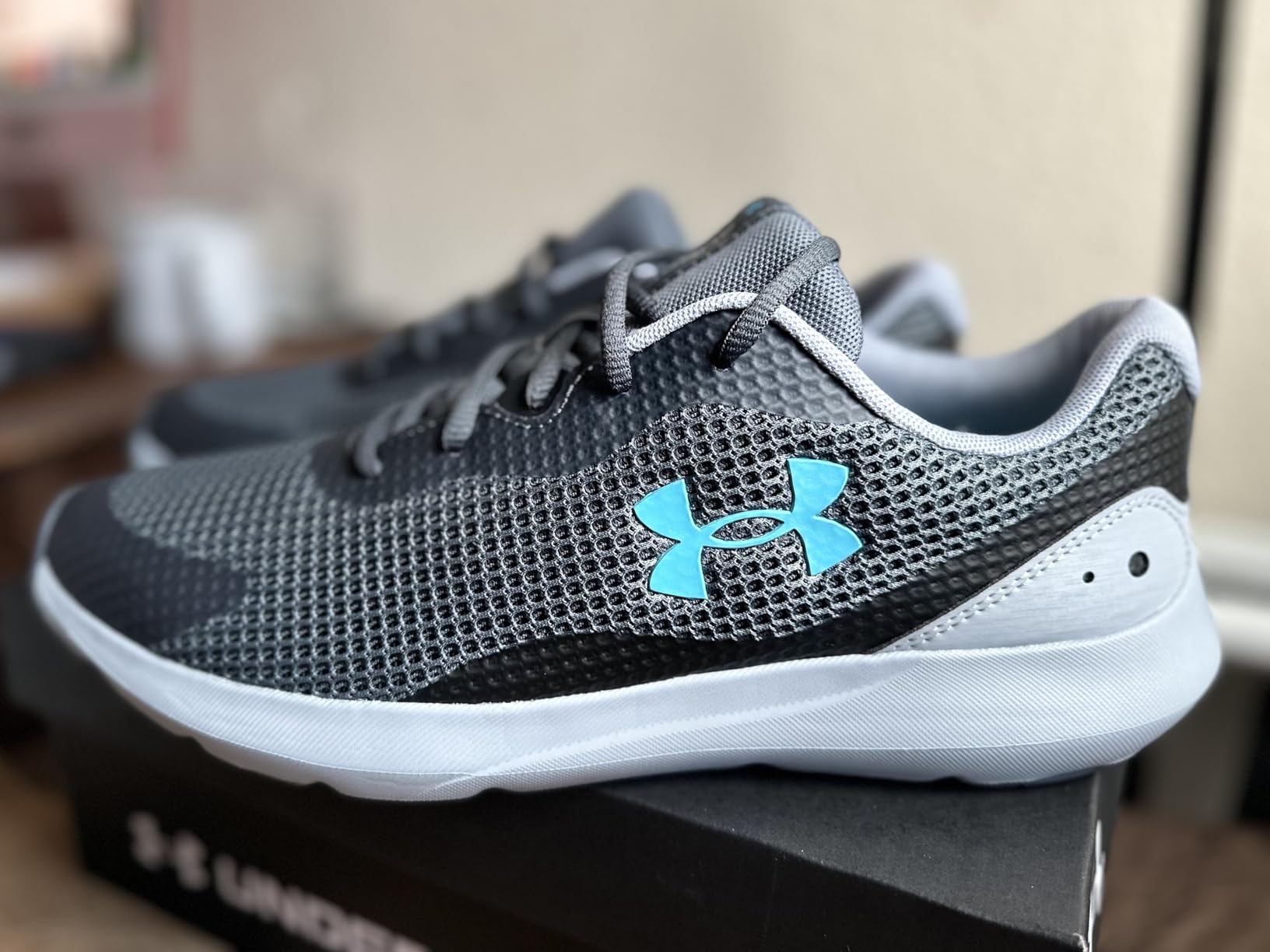 Under Armour Surge 3 side profile showing EVA midsole height and rubber pod outsole pattern