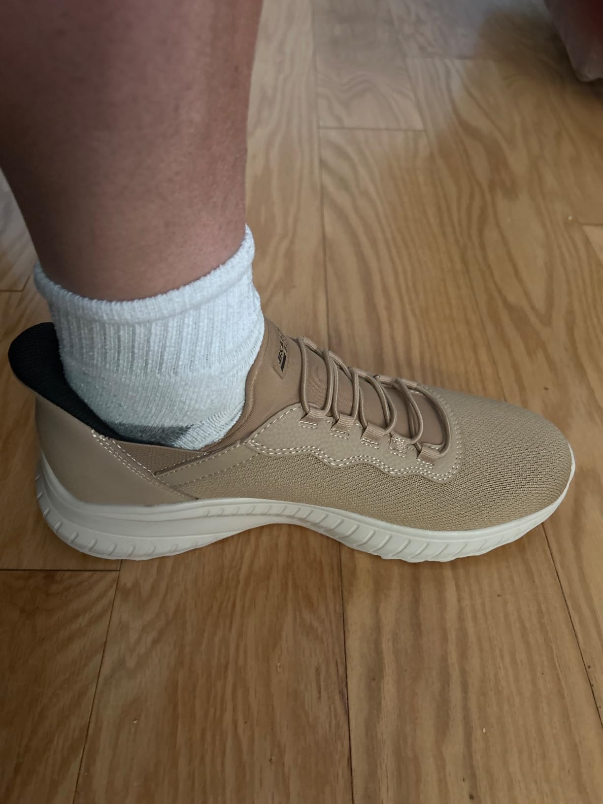 Skechers slip-ins styled with casual jeans showing lifestyle versatility and clean aesthetic