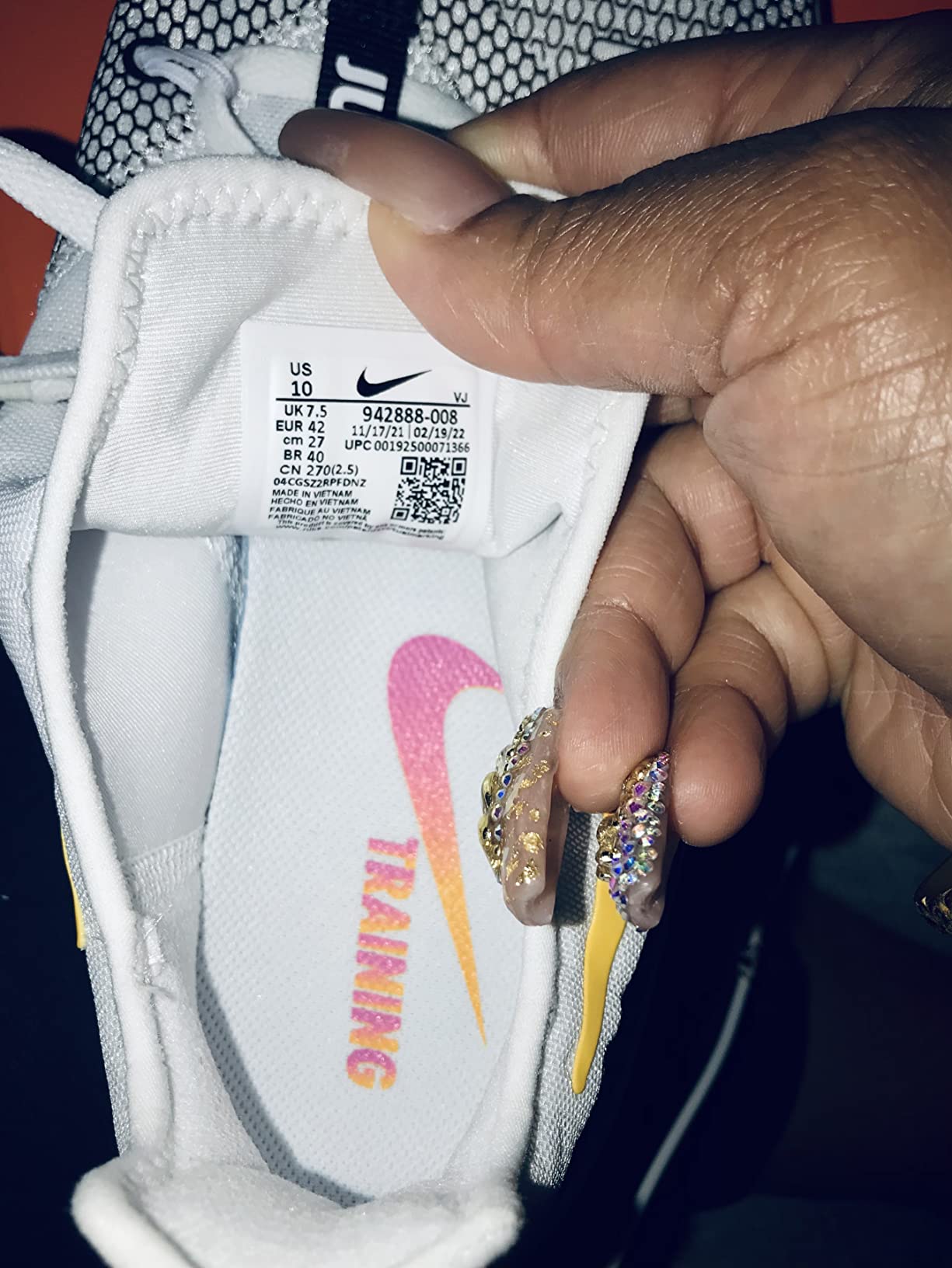 Detailed view of the Nike Women's training shoe outsole showing the flex groove traction pattern