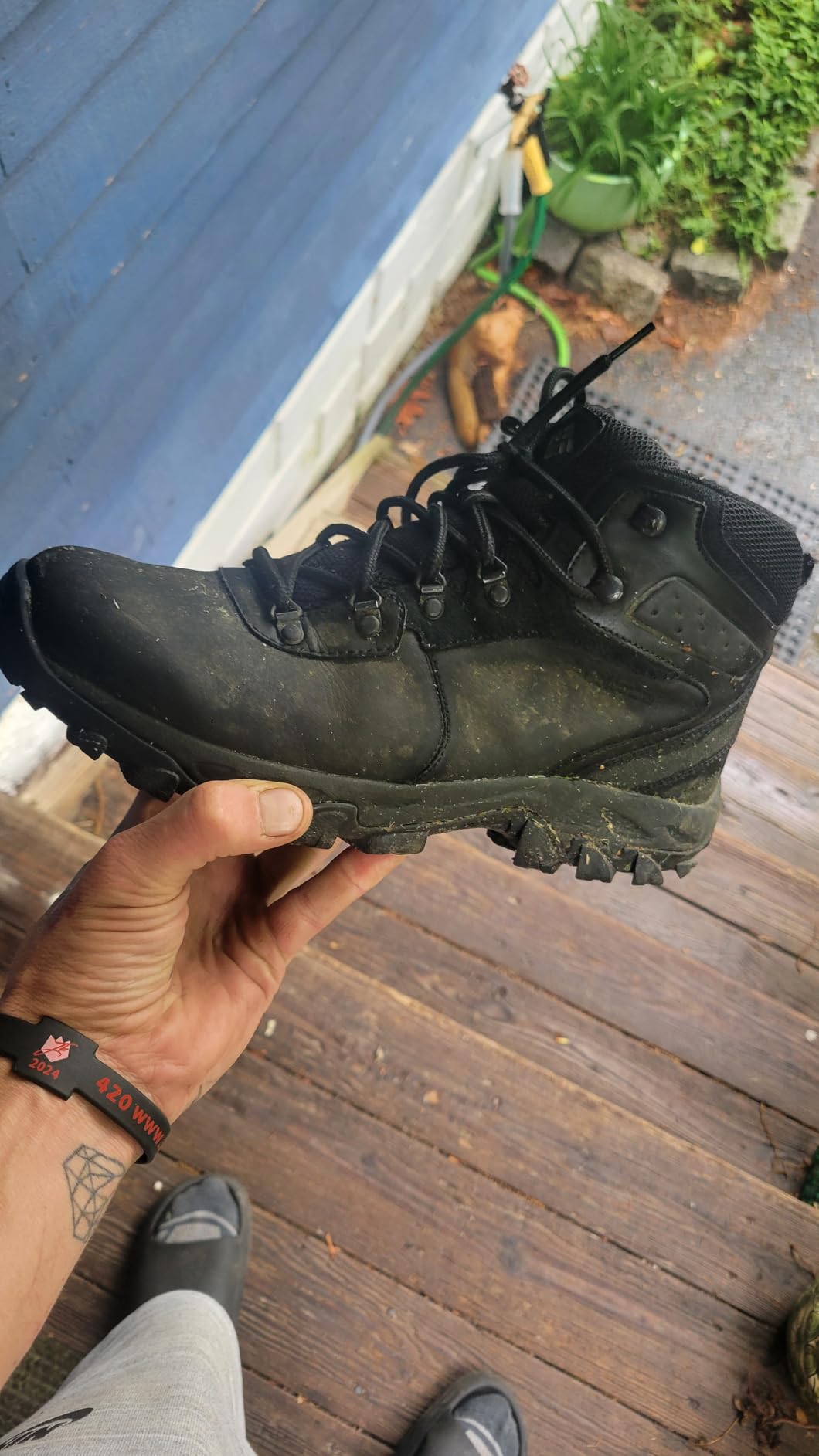 Close-up of Columbia hiking boot lacing system showing metal eyelets and D-ring hardware