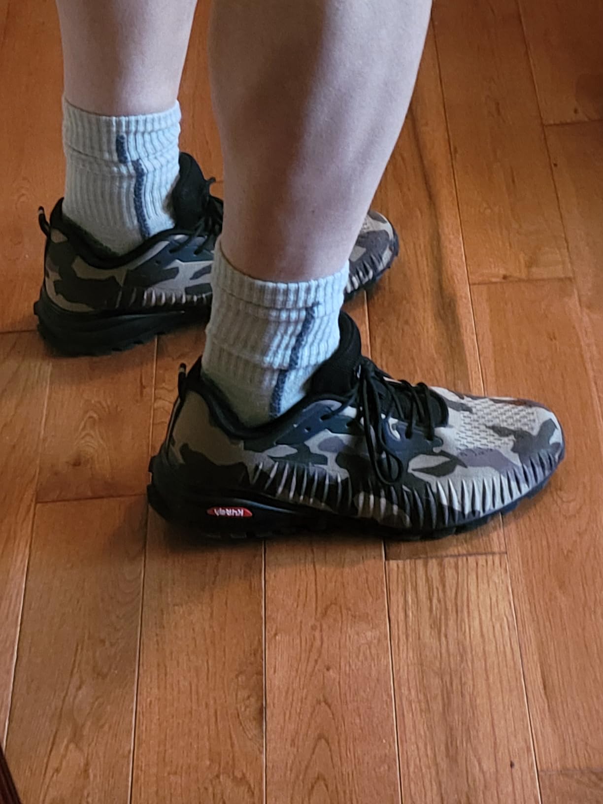 Muddy trail conditions showing Kricely shoe traction performance in challenging terrain