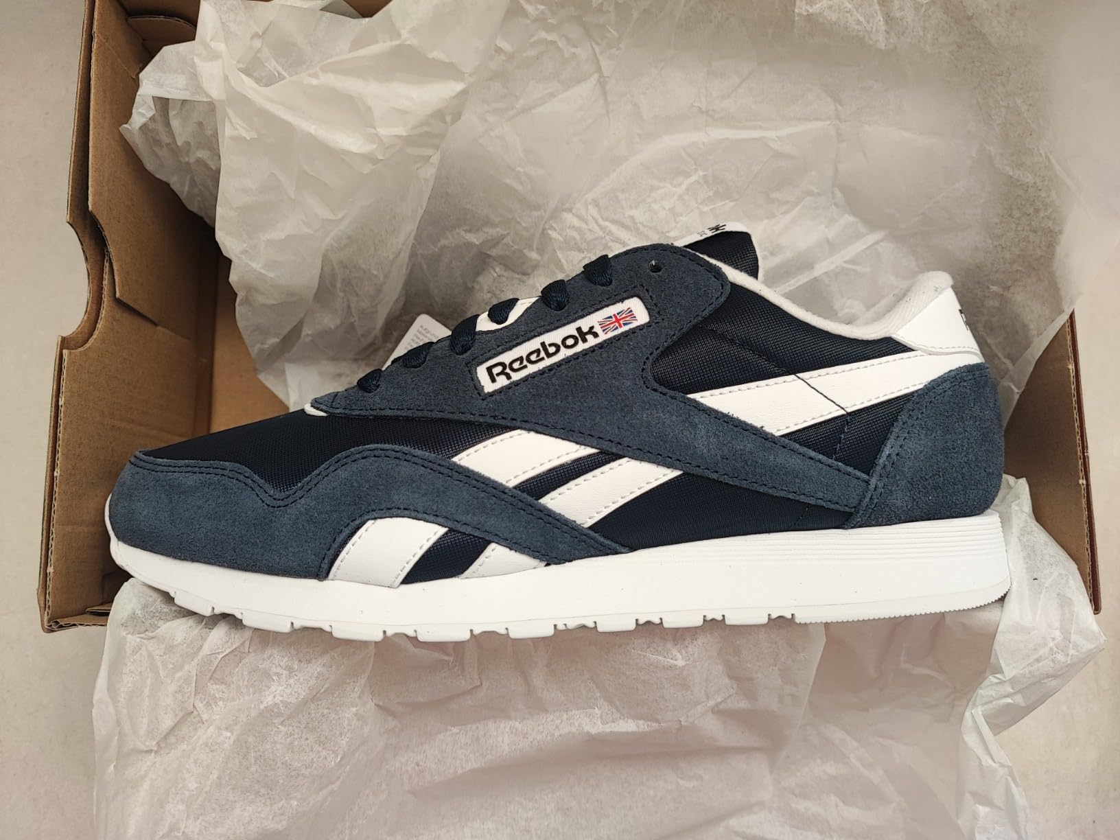Blue colorway Reebok Classic sneakers showing alternative color option and retro athletic styling