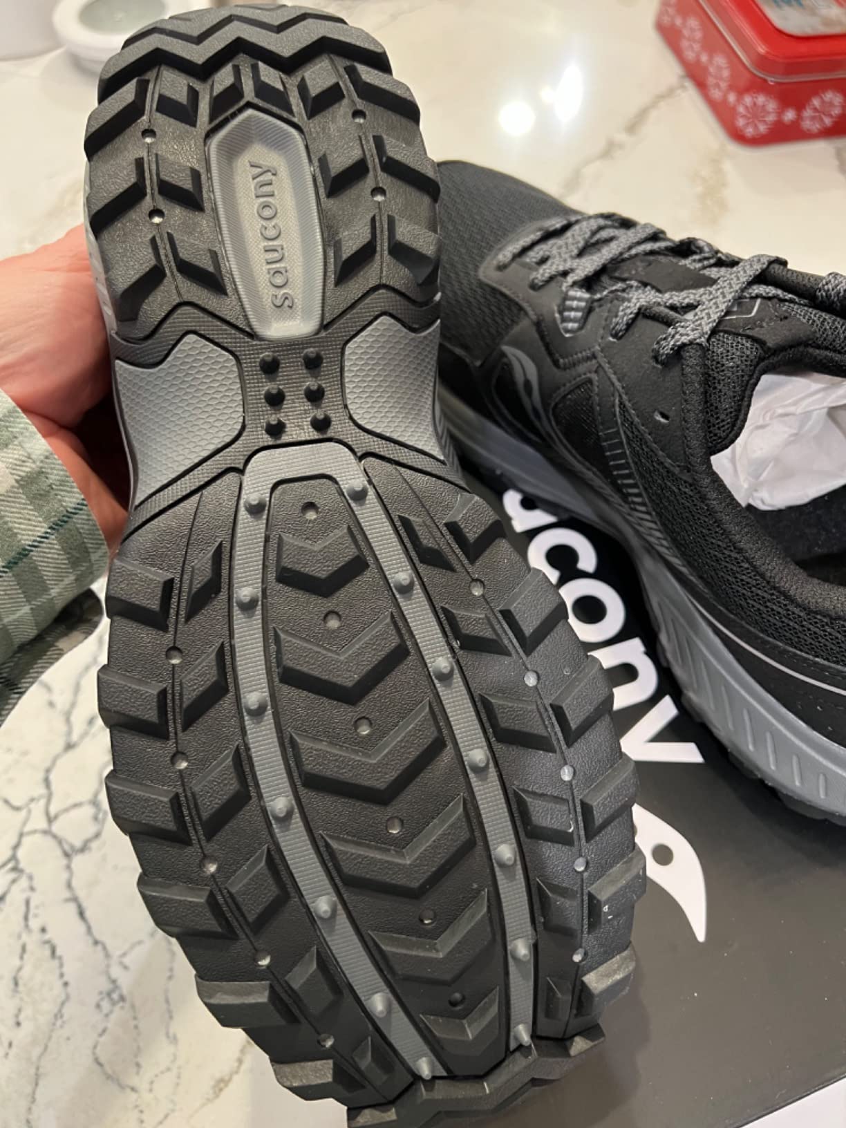 Saucony Excursion TR16 side profile showing VERSARUN midsole stack height and lug depth