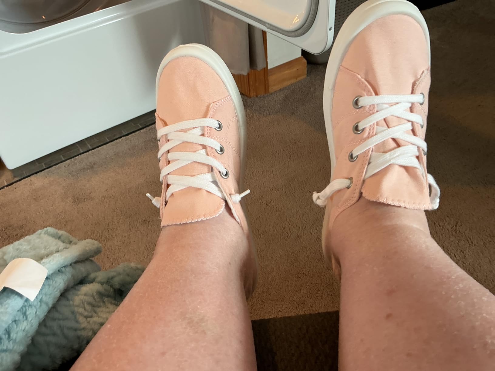 Pink Beneker canvas slip-on sneakers showing elastic tongue design and canvas upper construction detail