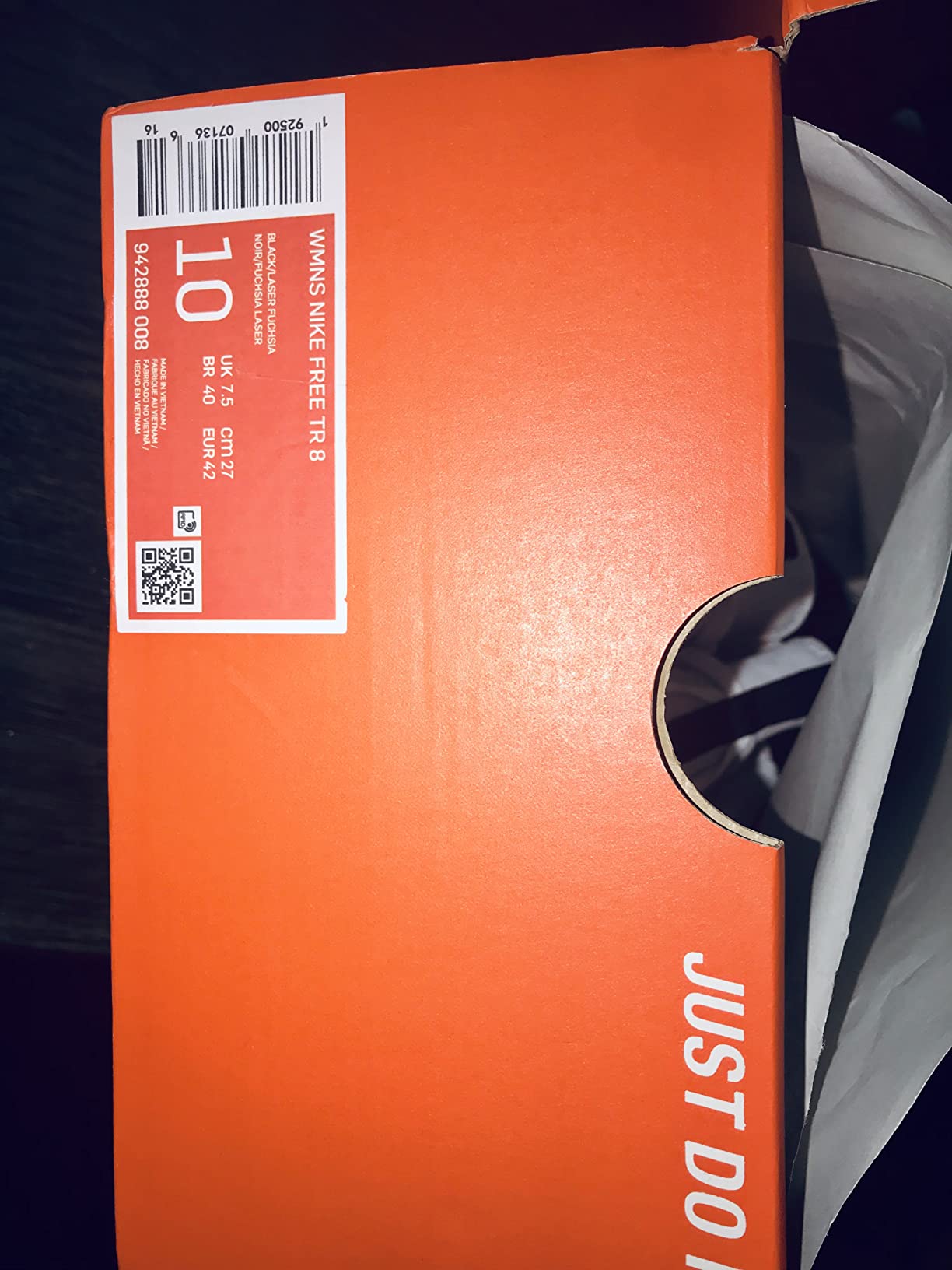 Close-up of Nike Women's training shoe showing branding and construction quality details