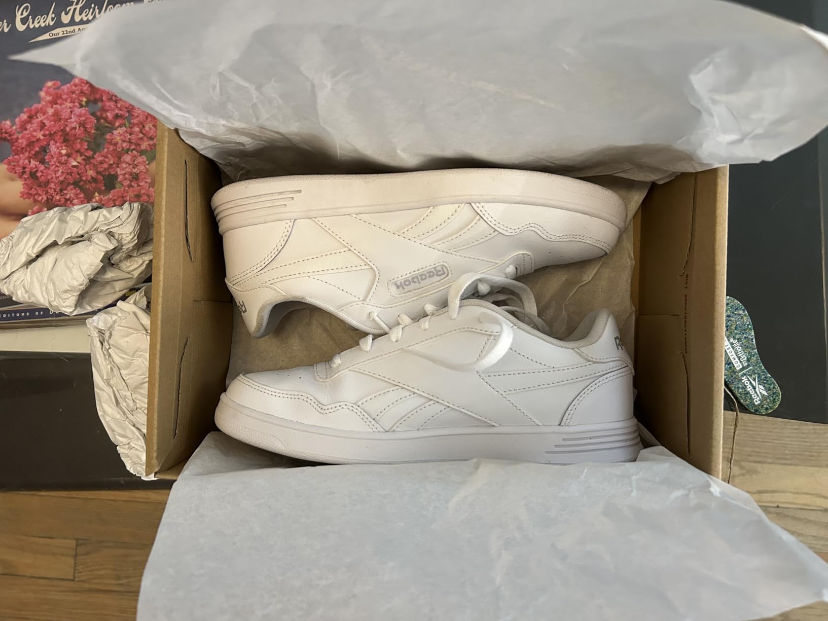 Reebok Court Advance detail showing soft leather upper construction and perforated side panels for breathability