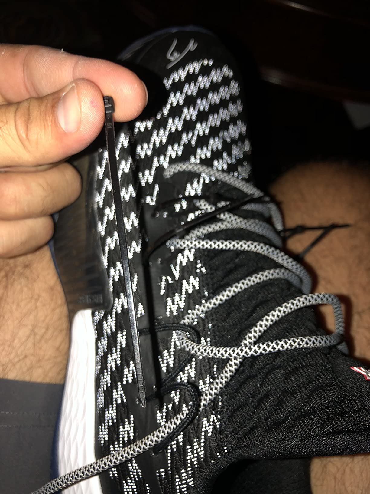 PEAK basketball shoe lacing system failure showing stress at integrated loop attachment points