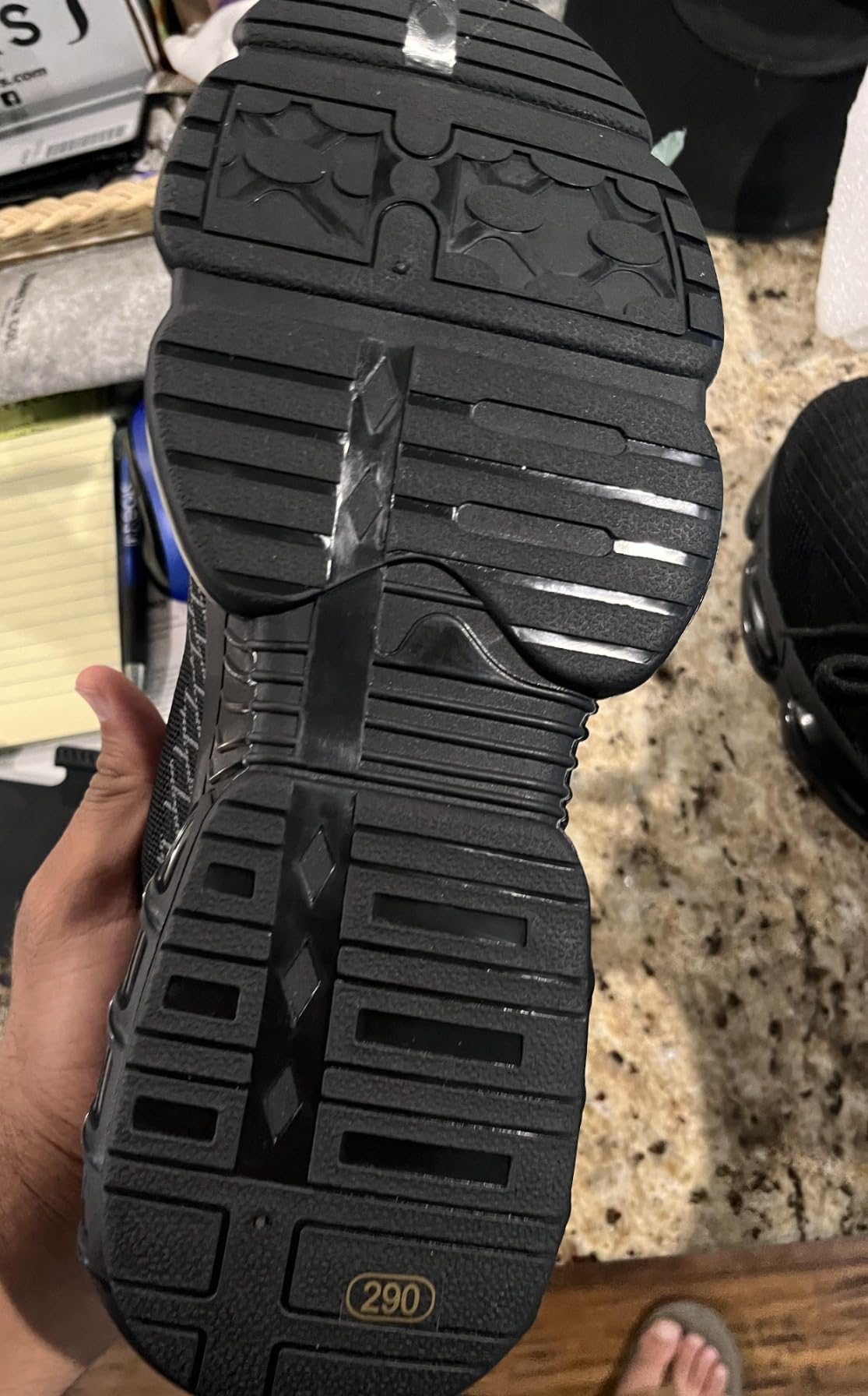 Steel toe work shoes being tested on construction site showing durability under real conditions