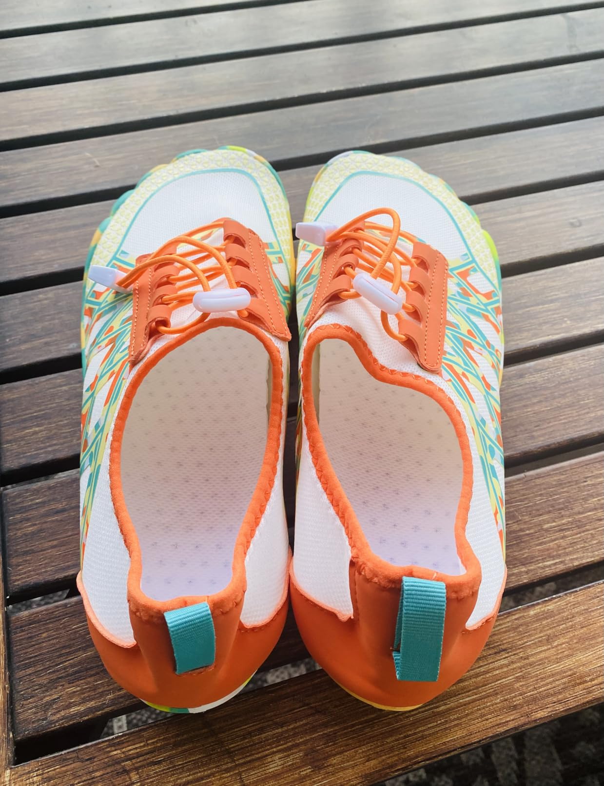 Side profile showing flexible barefoot design with smooth neck construction to prevent chafing during wear