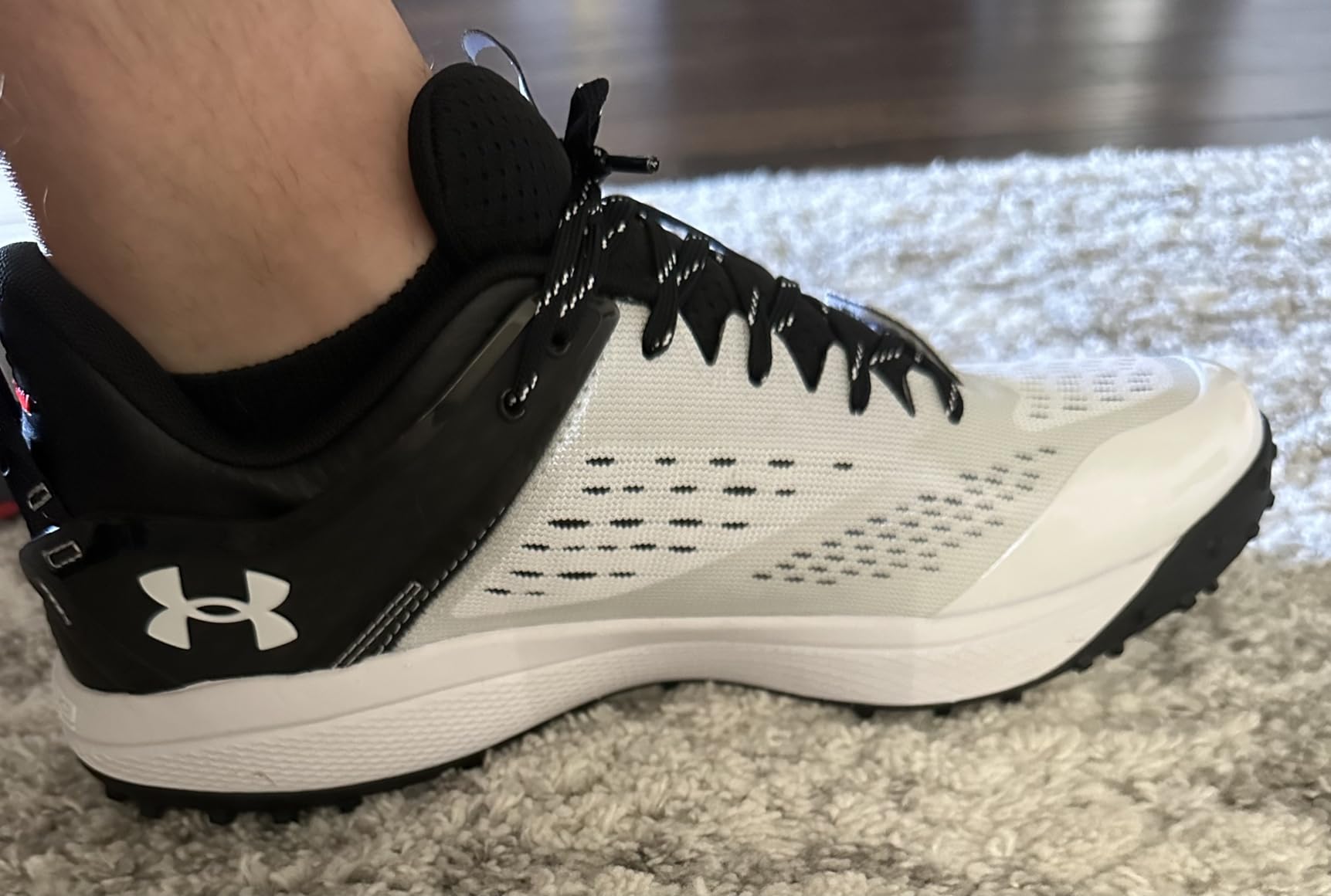 Under Armour Yard Low Turf cleat upper construction and lacing system close-up detail