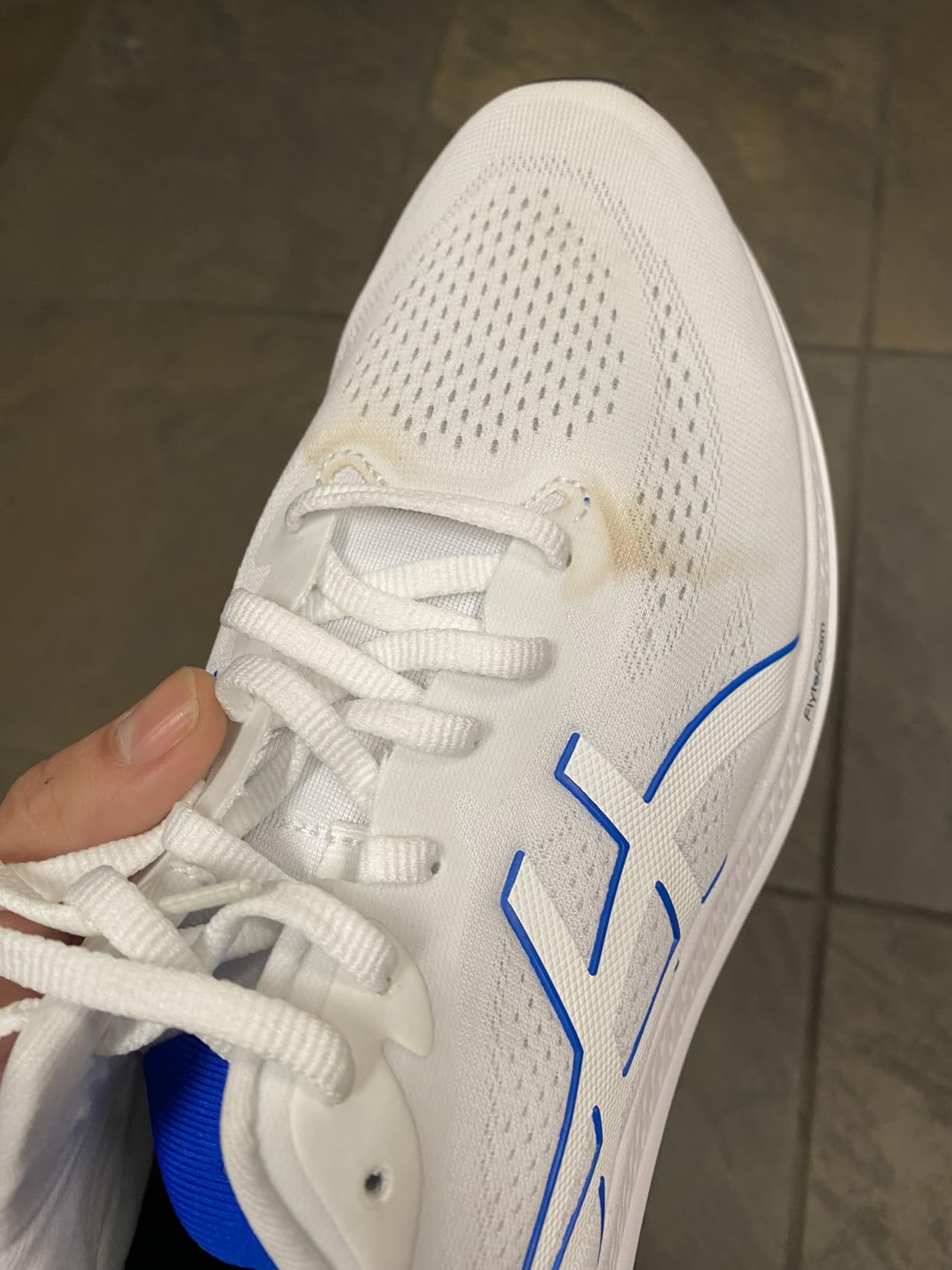 ASICS GT-1000 12 showing LITETRUSS technology and midsole construction detail
