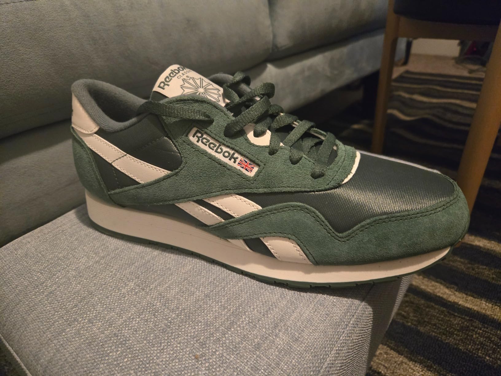 Reebok Classic sneakers in casual lifestyle setting showing outfit compatibility and real-world use context
