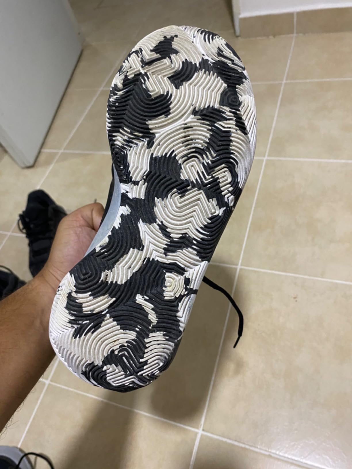 Under Armour Jet 23 on indoor hardwood court showing traction pattern grip during basketball play