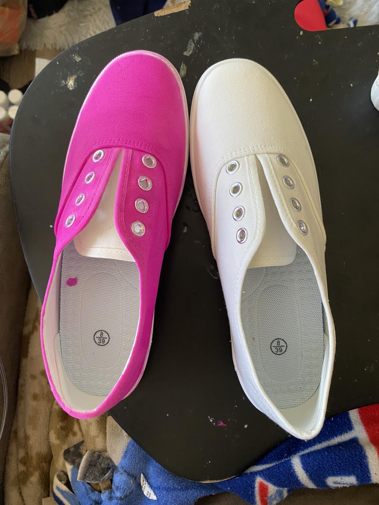 Pair of TUOPIN canvas sneakers on outdoor surface during real-world daily wear testing