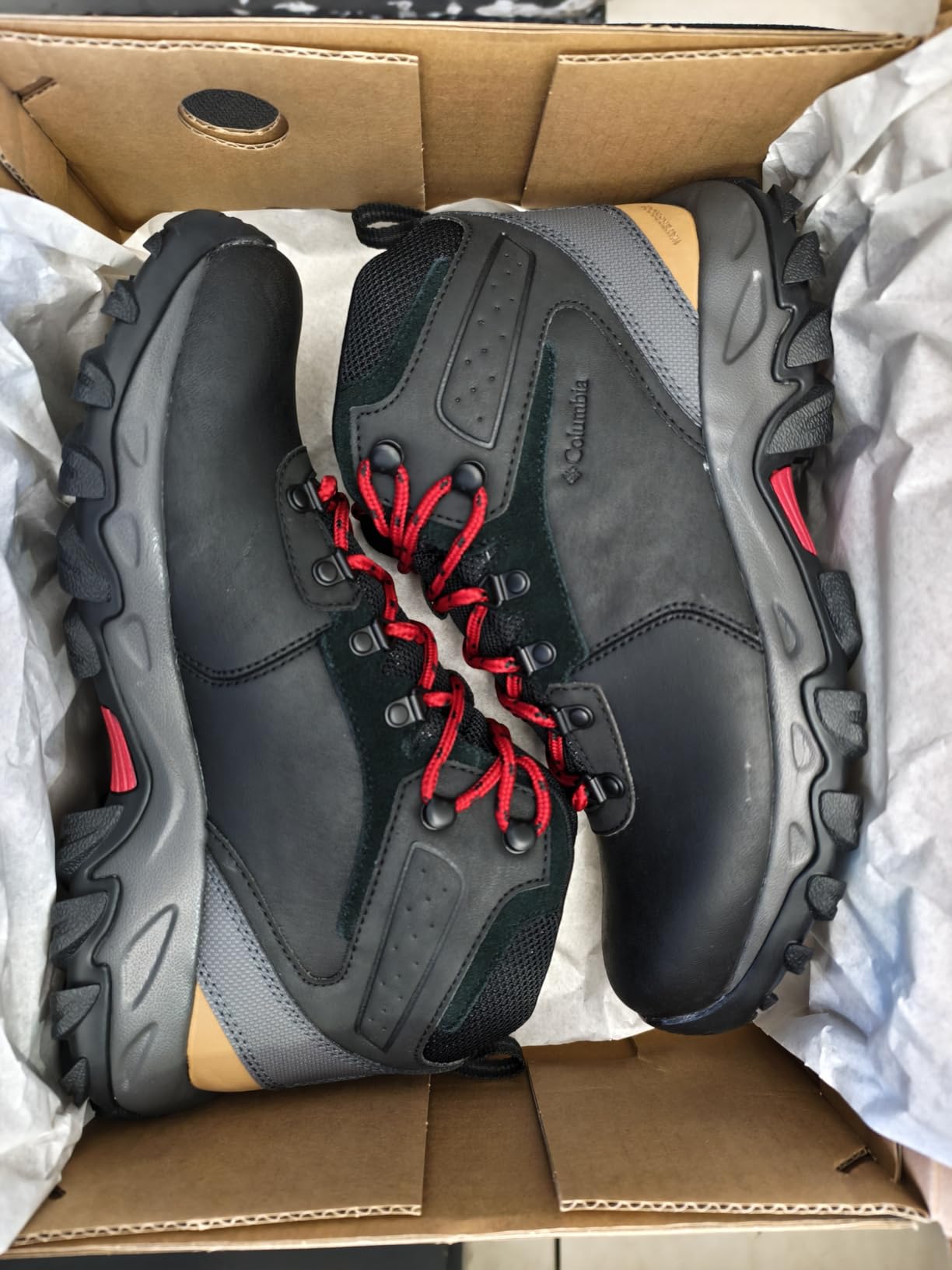 Well-worn Columbia Newton Ridge boots after extensive trail testing showing durability