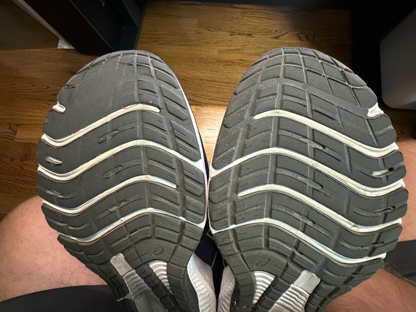 ASICS GT-1000 12 showing detailed outsole wear analysis