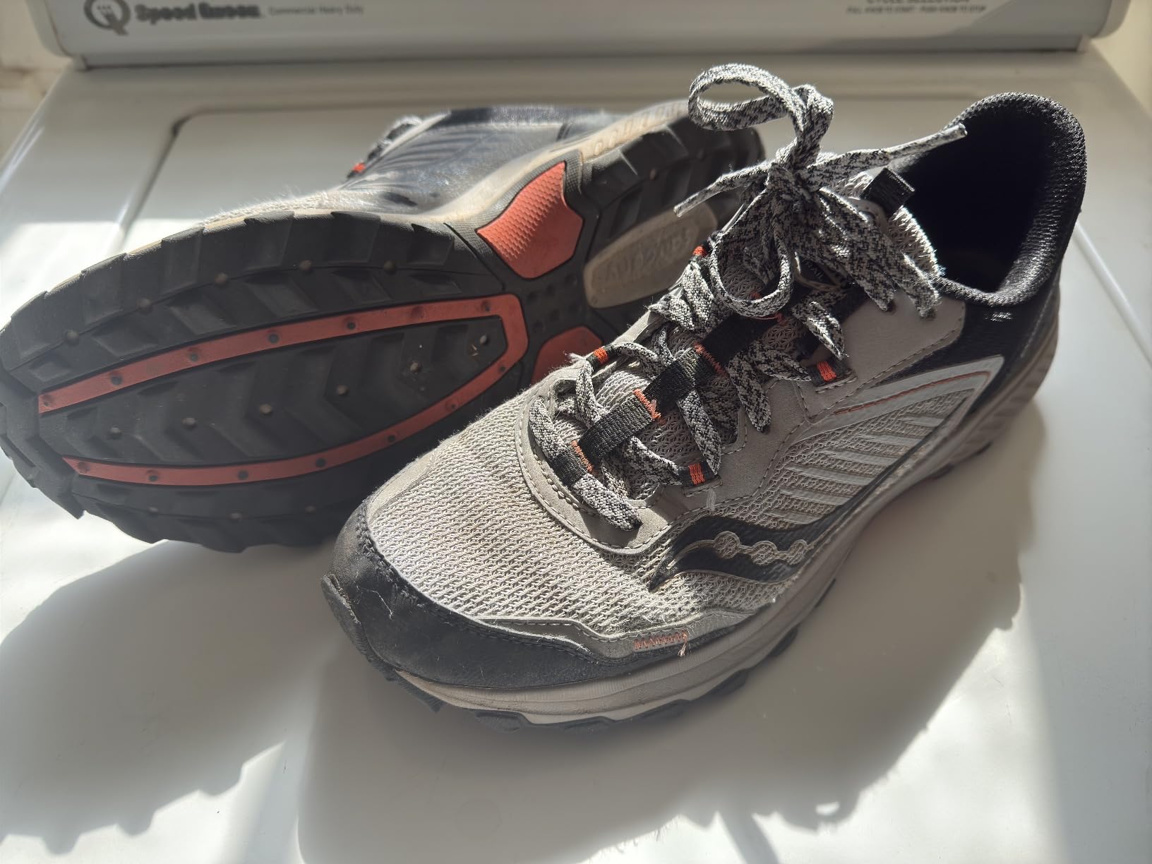 Saucony Men's Excursion TR15 trail running shoes in gray and black colorway with aggressive lugged carbon rubber outsole