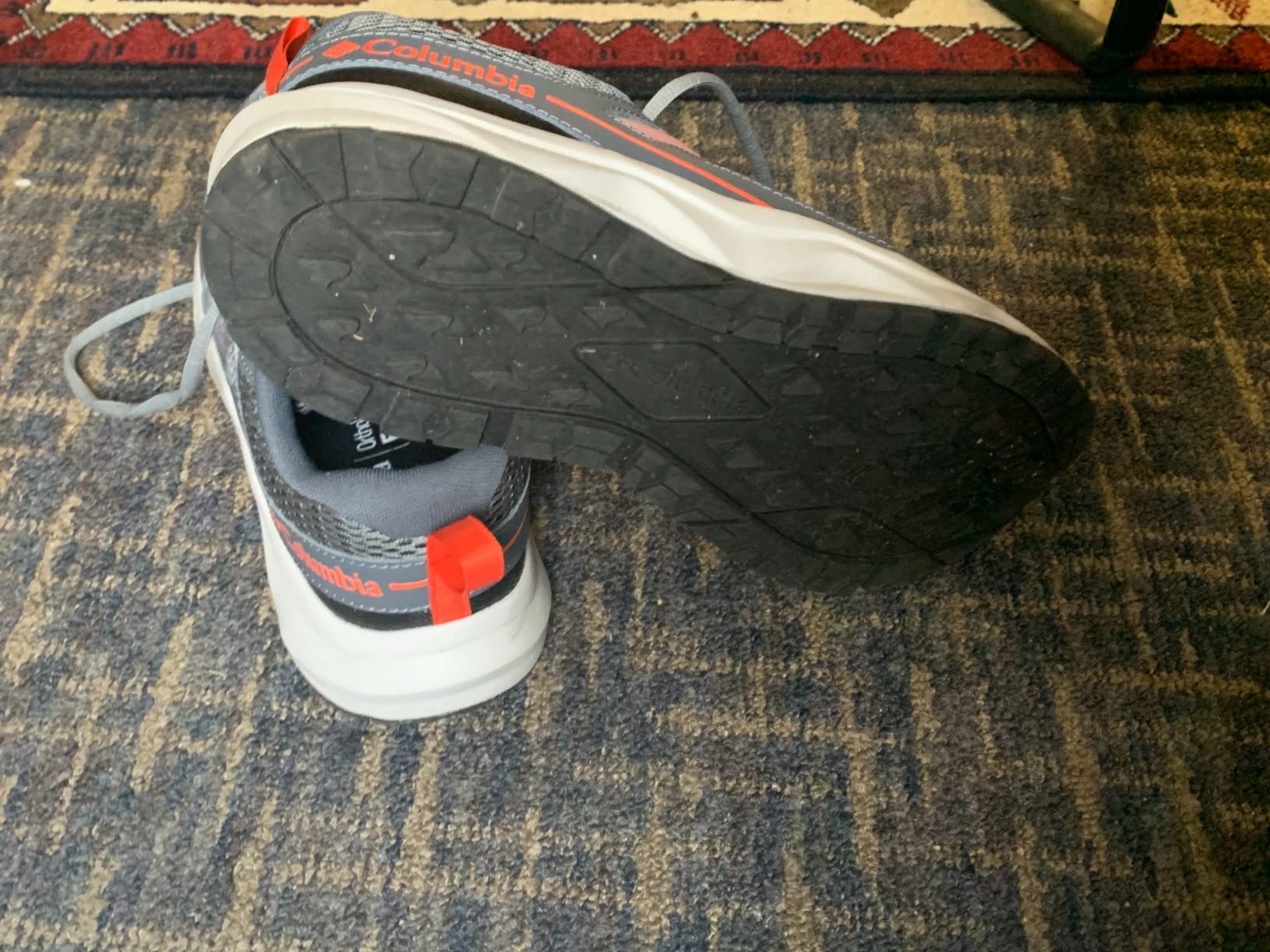 Columbia Men's Plateau Hiking Shoe in gray and orange colorway, showing breathable textile upper and synthetic overlays