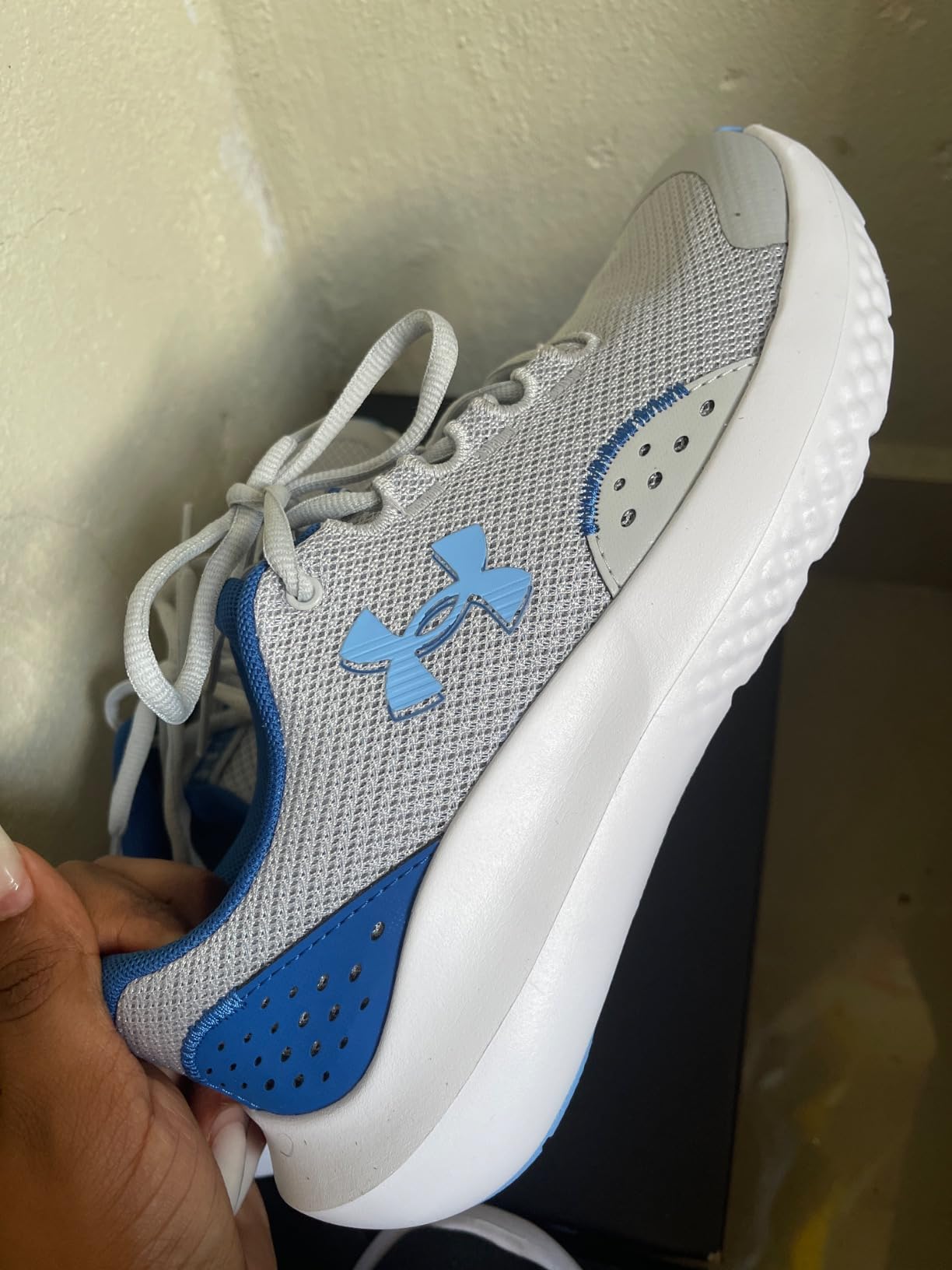 Under Armour Boys Grade School Surge 4 lifestyle shot showing real world usage by active kids