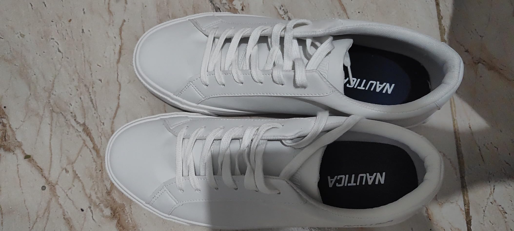 Overall view of Nautica men's casual shoes from multiple angles showing complete design and styling