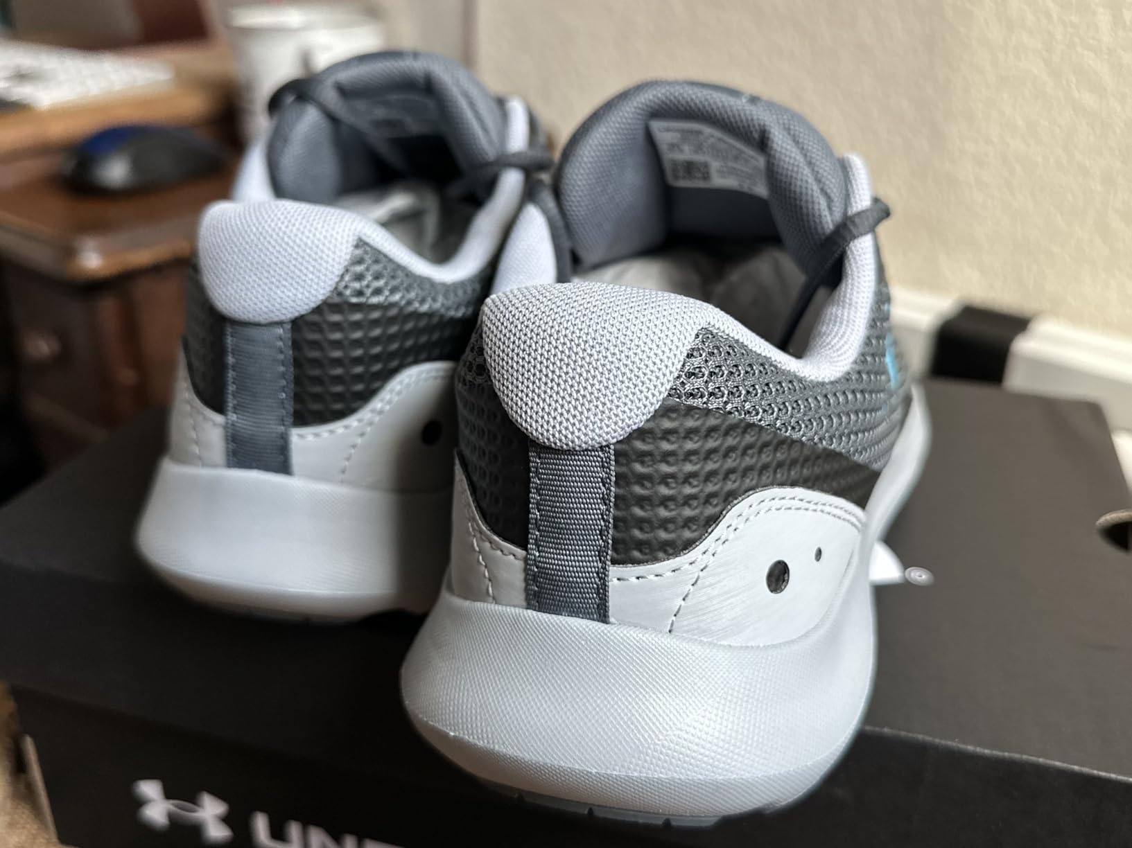 Under Armour Surge 3 upper and lacing detail showing mesh construction and synthetic overlay panels