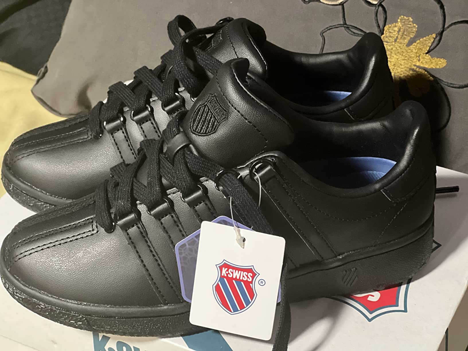 K-Swiss Classic VN black sneaker styled for professional casual wear showing versatility for work settings