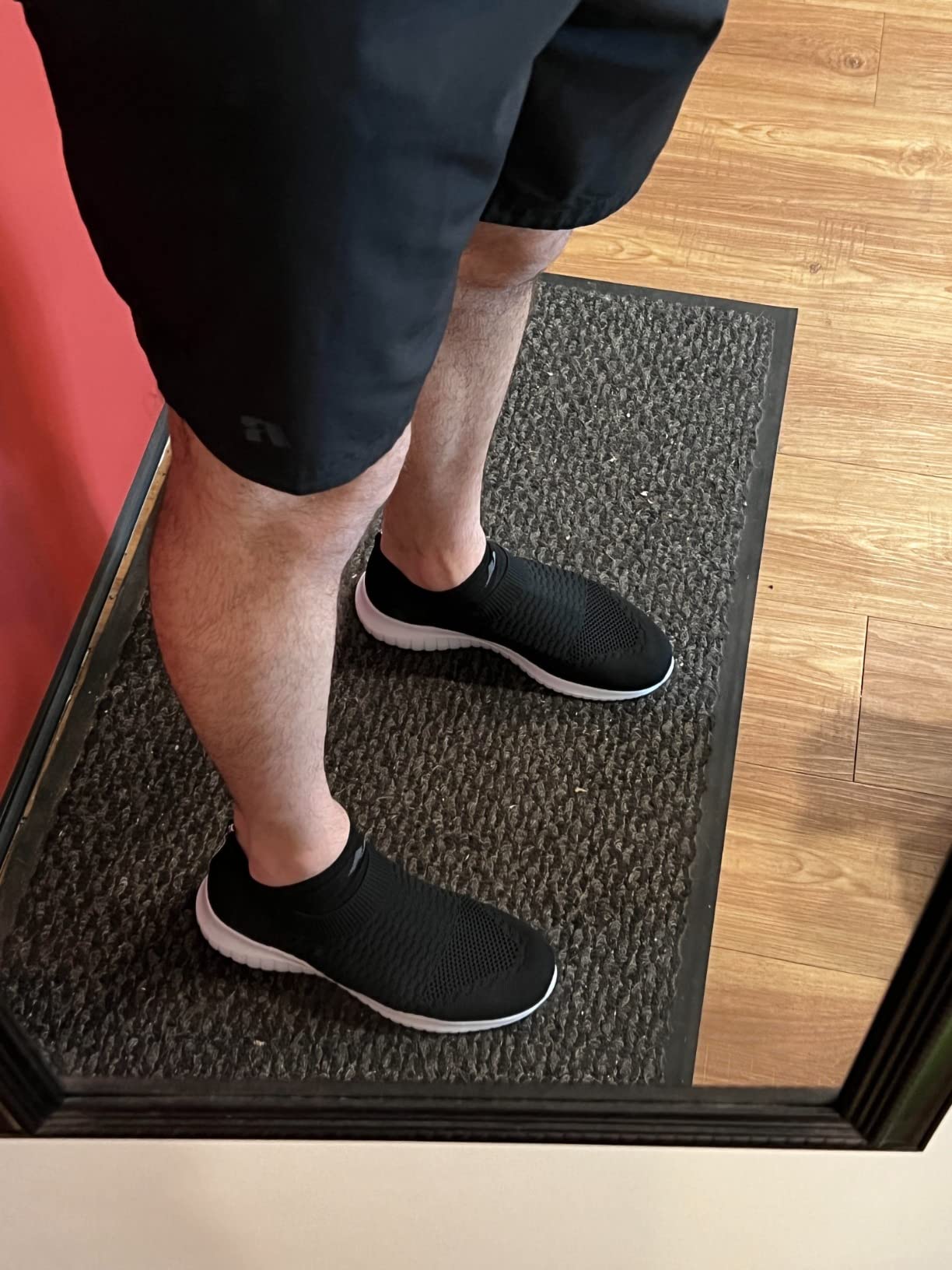 Konhill mens athletic walking shoes side profile showing narrow sole width and slip-on construction design