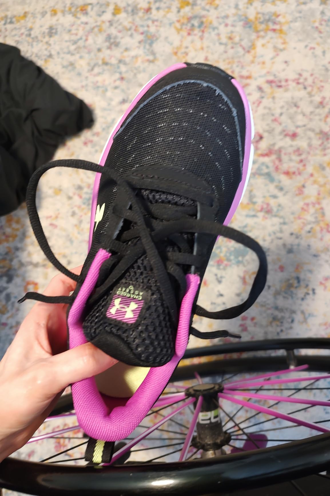Close-up of synthetic overlays on Under Armour Assert 10 showing reinforcement at high-wear areas