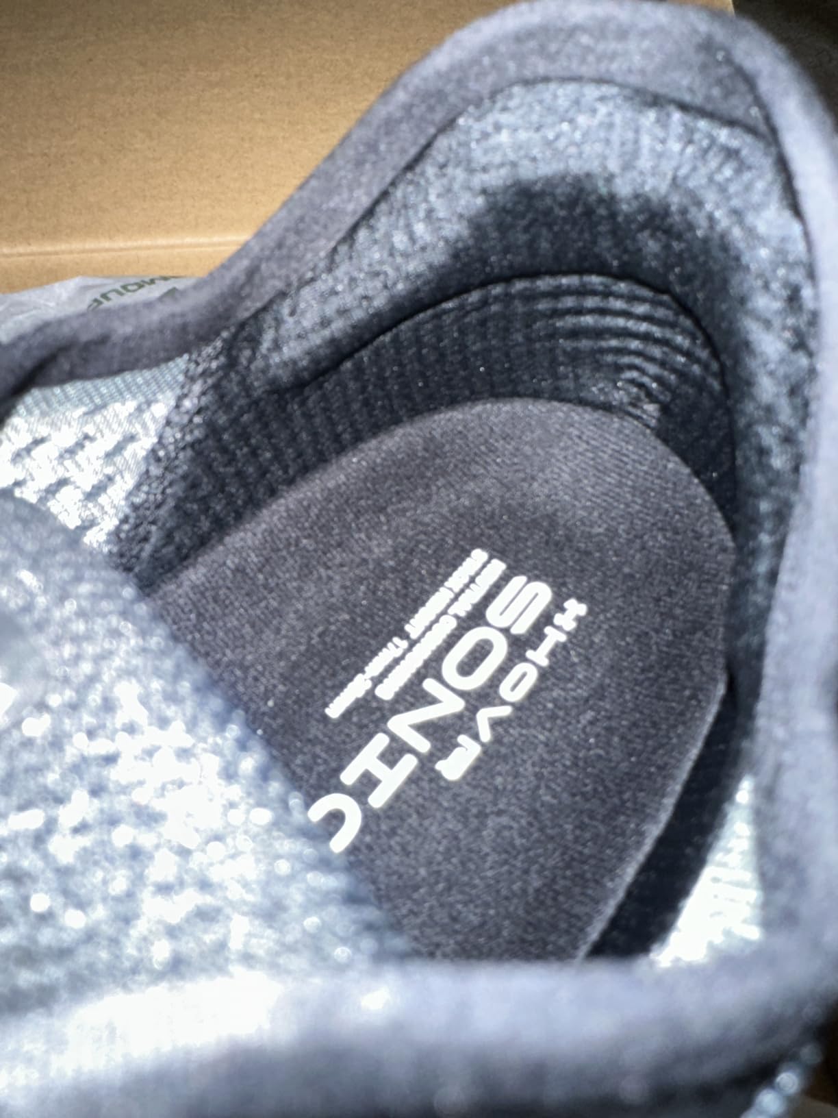 Under Armour Men's HOVR Sonic 6 running shoe showing engineered mesh upper and external heel counter