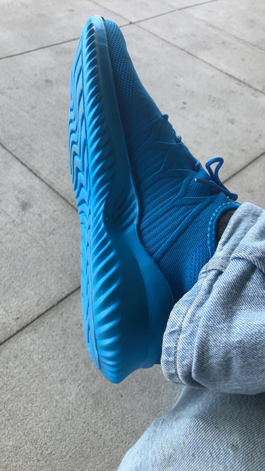 Socviis mens slip on running shoes in light blue colorway showing breathable mesh upper and flexible MD sole design