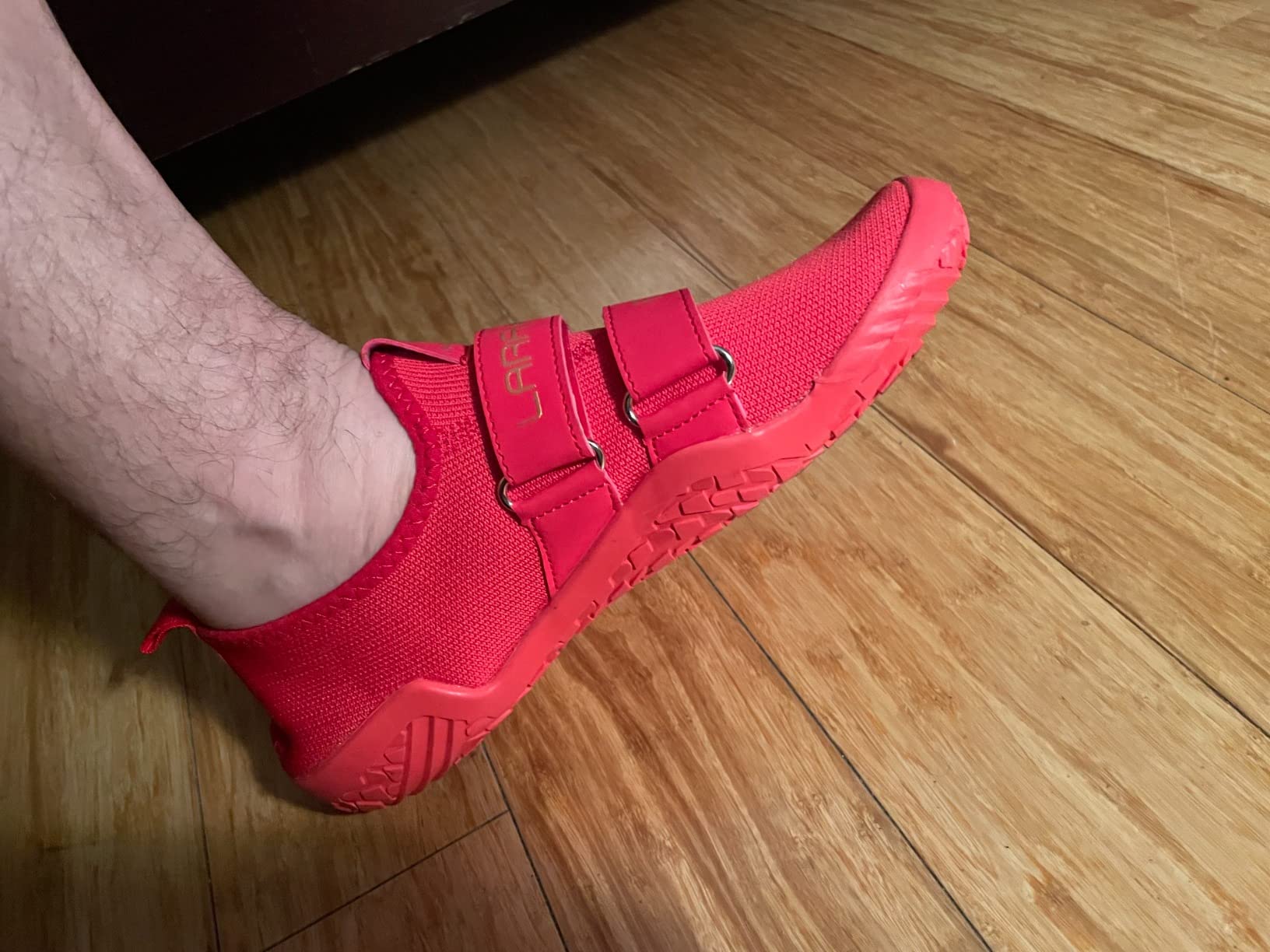 Side profile showing completely flat sole design with zero heel drop