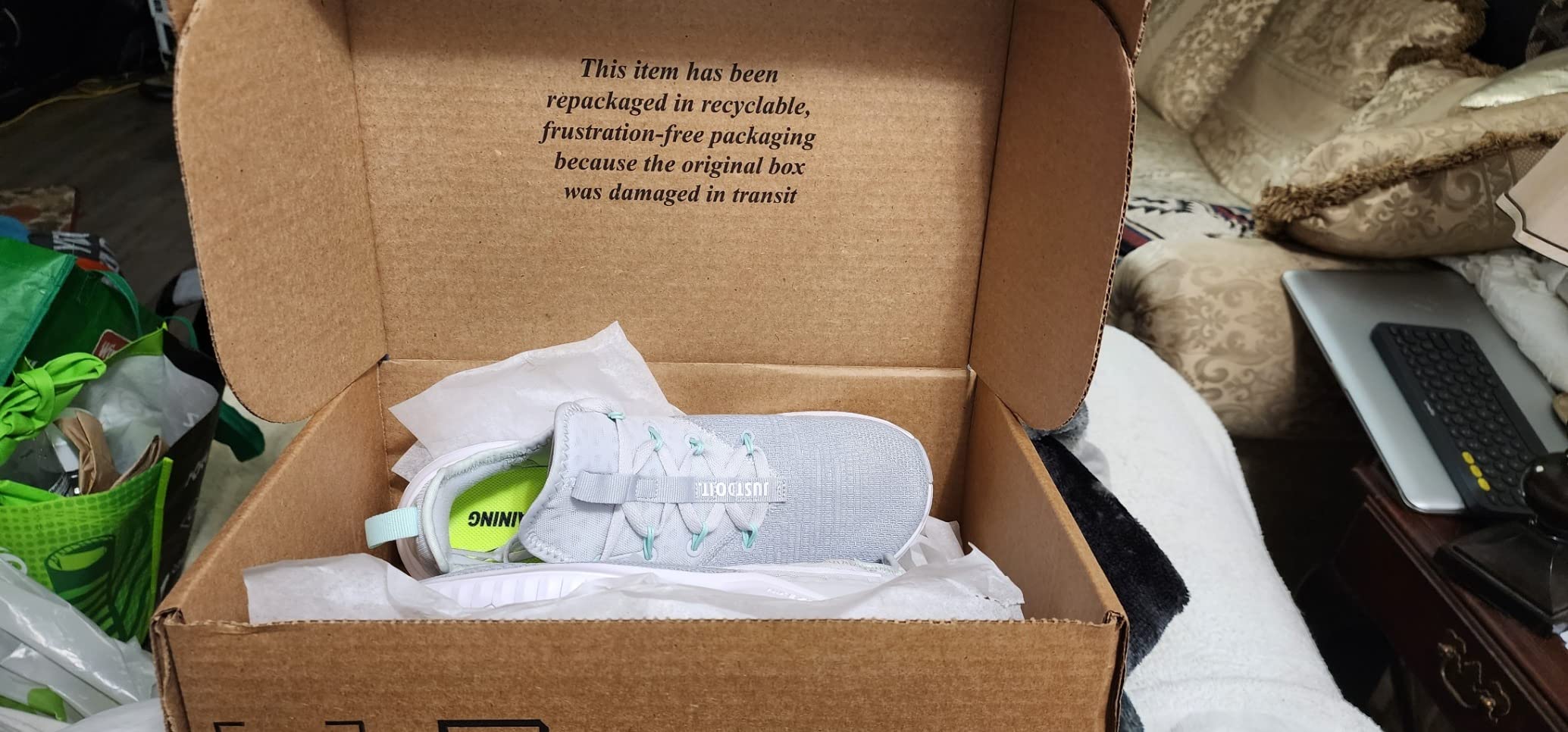 Side profile of Nike Women's training shoe showing dual-fusion midsole height and outsole flex groove pattern