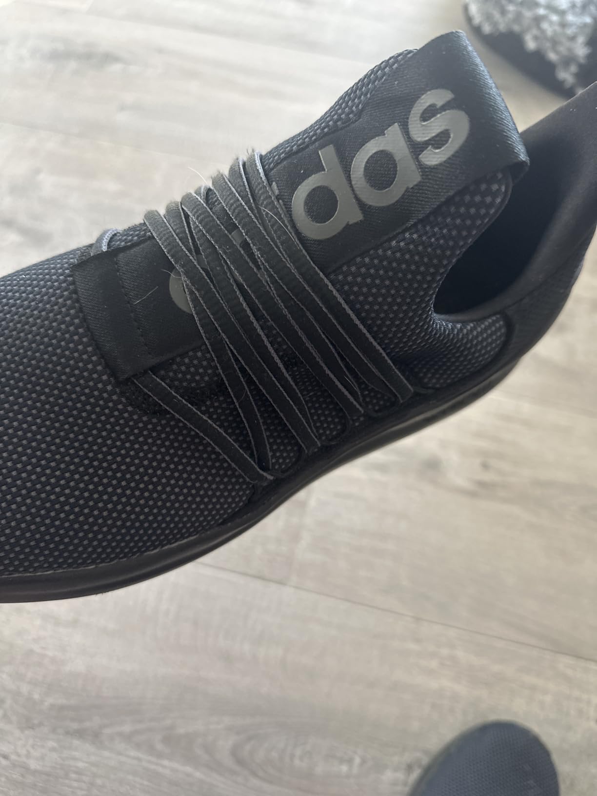 Adidas Lite Racer Adapt 7.0 on gym floor during workout session showing real-world performance context