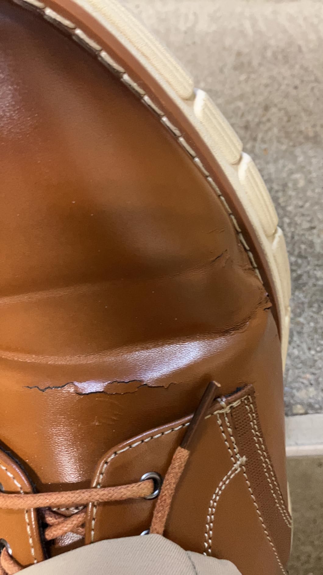 Close-up material wear cracking Bruno Marc Crossflex showing early stage synthetic upper deterioration flex points stress areas